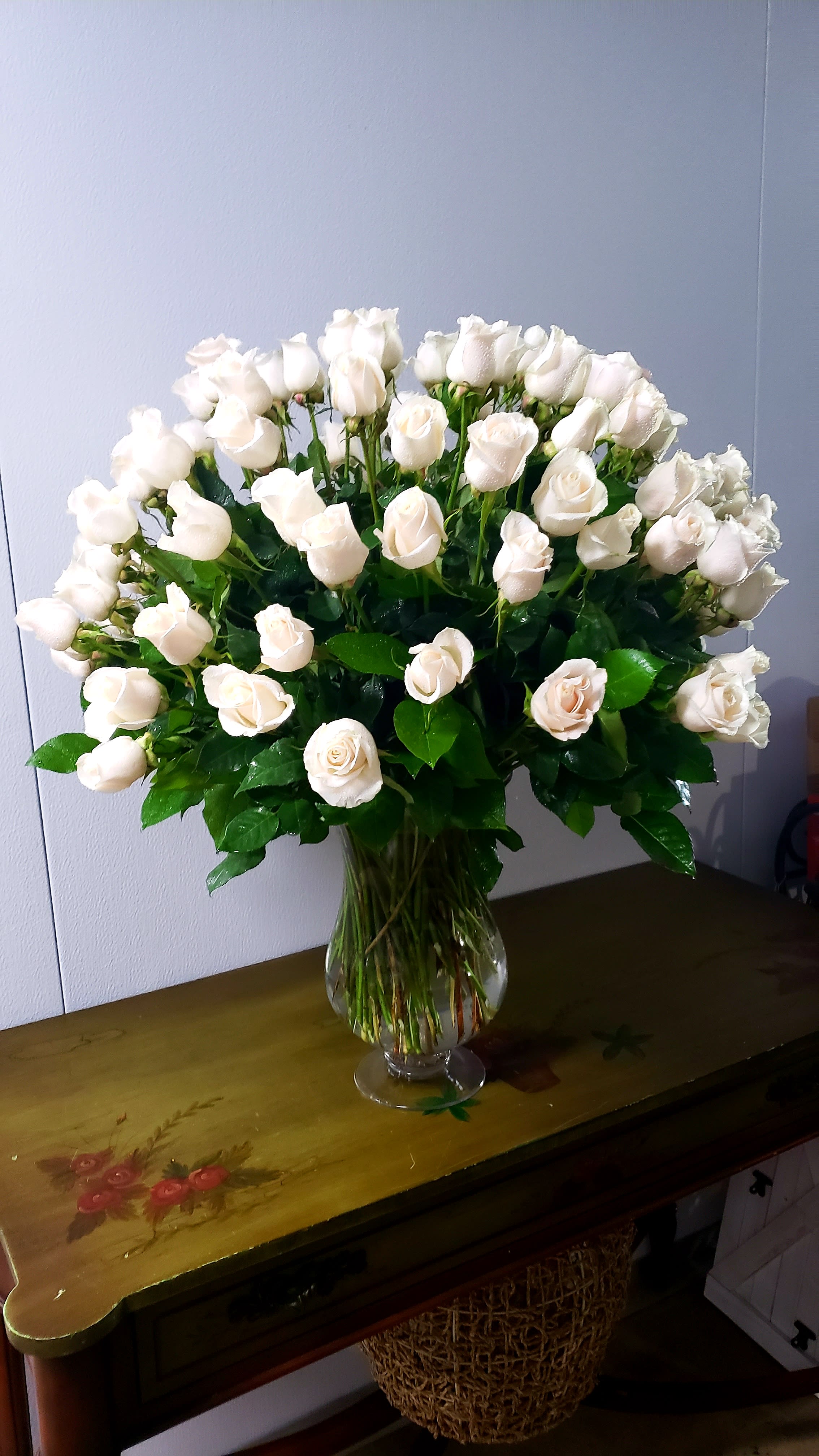 8 Dozen White Roses - Make a breathtaking statement with this opulent arrangement featuring eight dozen pristine white roses, artfully arranged in an elegant vase. Designed for impact, this large-scale display exudes timeless beauty and sophistication—perfect for grand gestures, upscale events, or making an unforgettable impression.  Please note: Floral variety and vase may vary depending on availability, ensuring each arrangement is fresh and unique.  Freshness Guarantee: At Belden's Florist, we stand behind the quality of every arrangement. Our flowers are guaranteed to remain fresh and beautiful for 3–5 days after delivery. While cut flowers may naturally begin to wilt beyond this timeframe, we ensure that only the freshest blooms are selected and expertly arranged to bring joy and elegance to your space. To extend their life, we recommend refreshing the water in your vase daily, allowing your flowers to stay hydrated and continue to dazzle