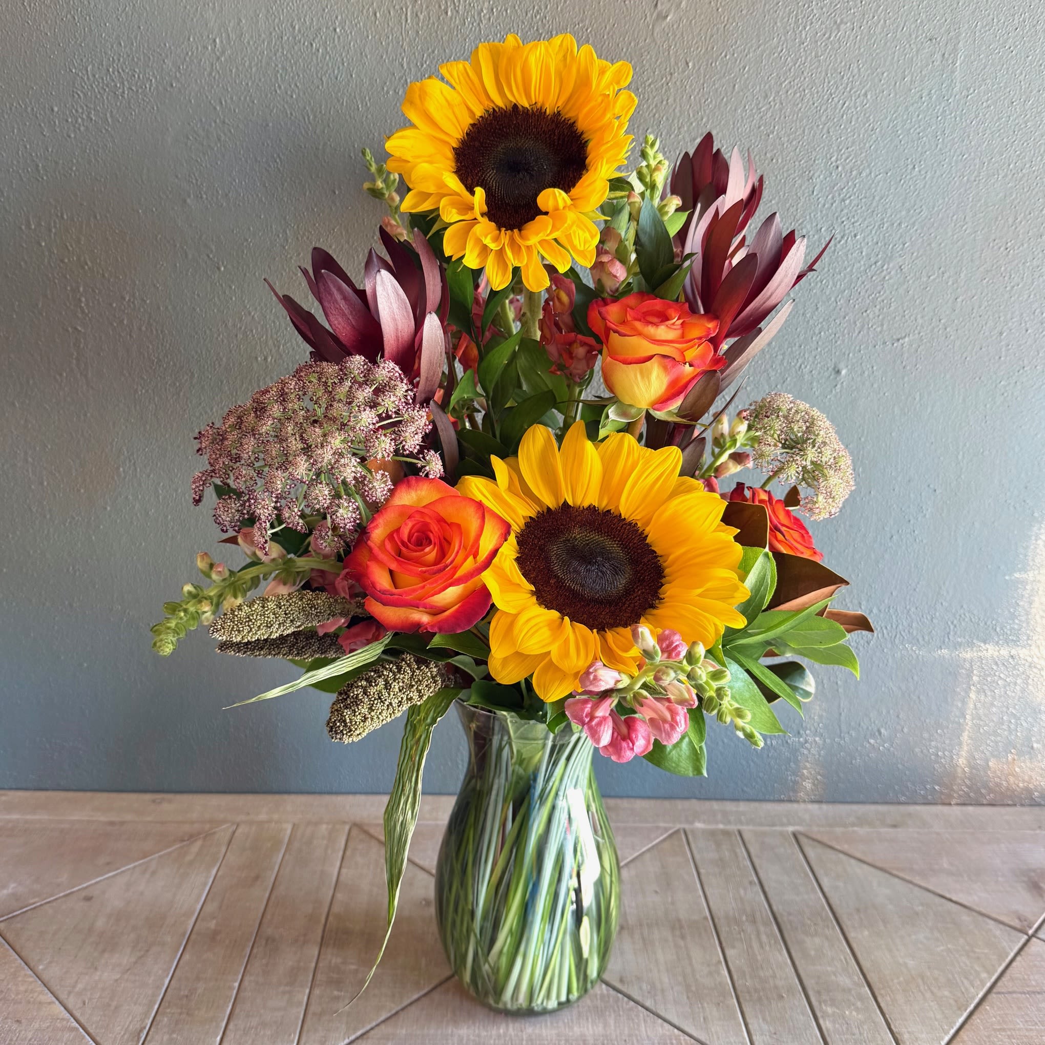 Sunflower Serenade - Have someone singing your praises when they receive this beautiful arrangement featuring beautiful sunflowers!