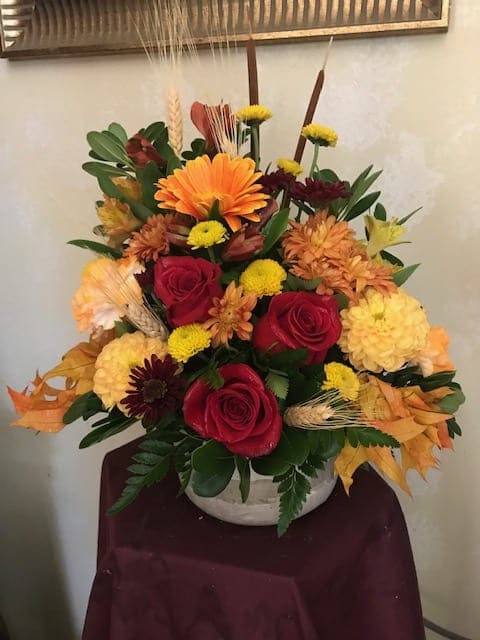 AUTUMN IN STONE - A lovely autumn arrangement in a stone container. Bright, colorful and seasonal.