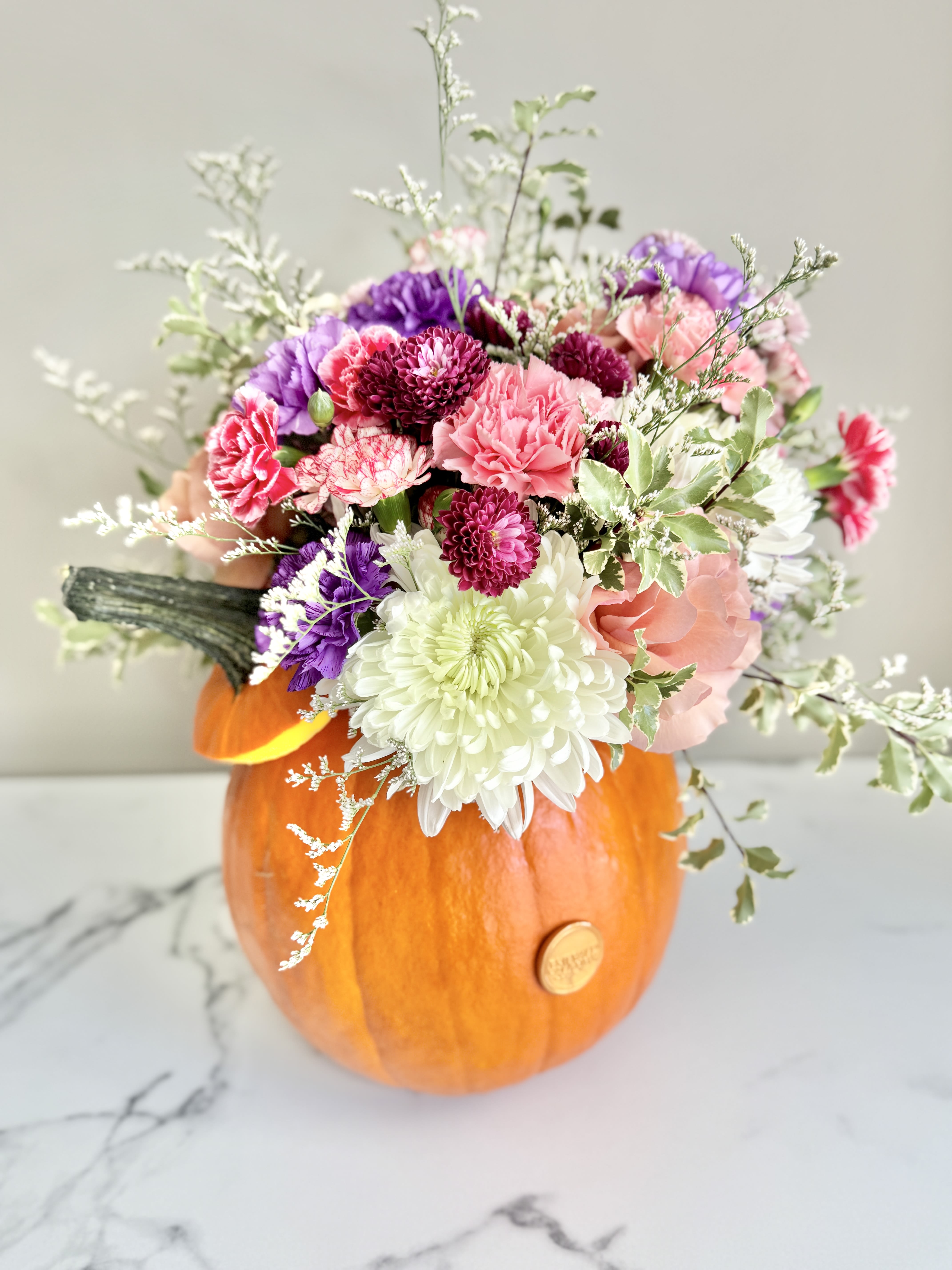 Pumpkin Power Blooms - Combine your Flower Power with Pumpkin Power with this wonderful, dare we say “powerful,” seasonal arrangement. Housed in a real pumpkin, you will surely “fall” in love with this collection of fall flowers this fall.