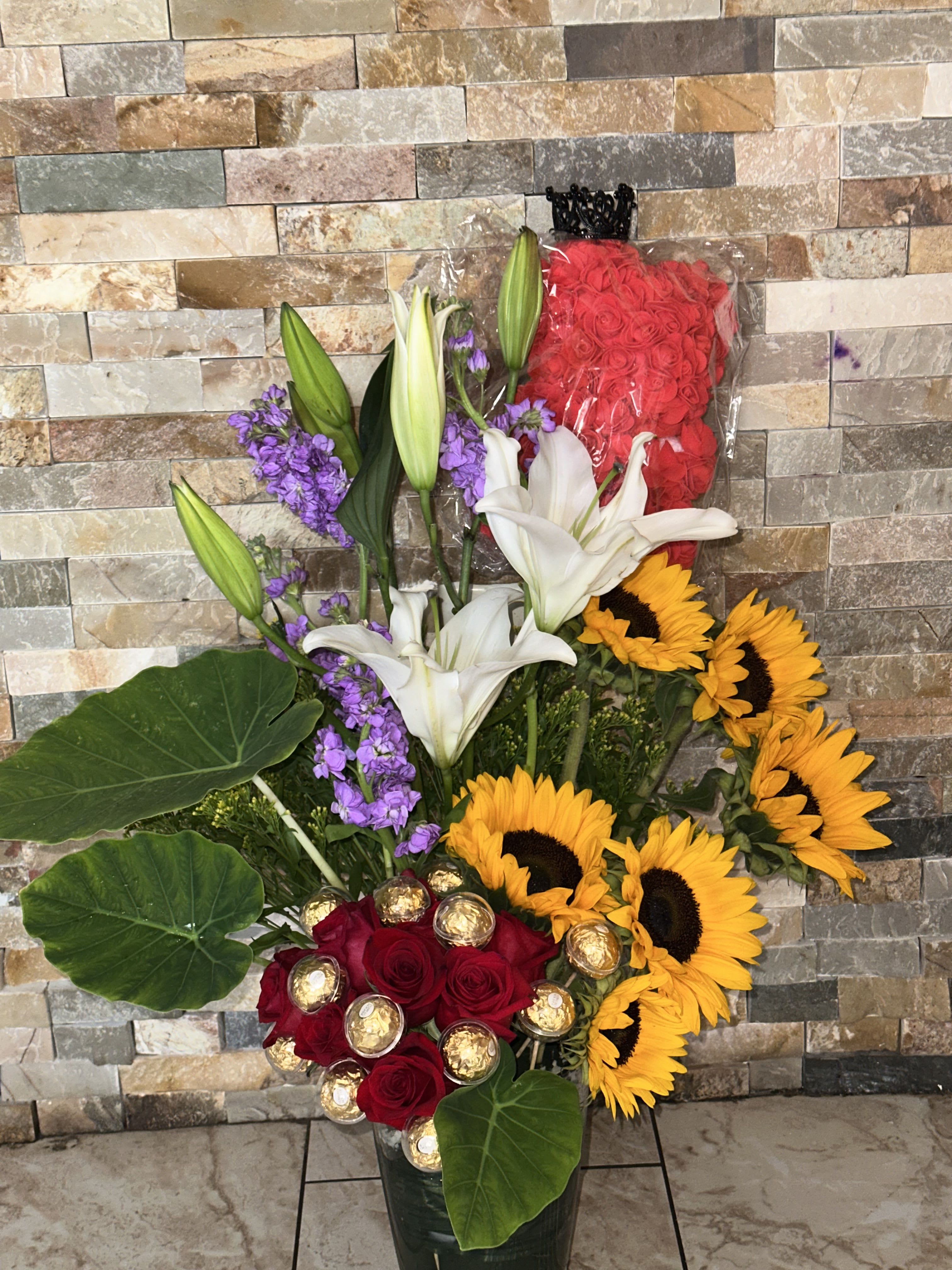 Magic Queen - This arrements included everything that real Queen deserve chocolate, teddy bear, crown and our luxury flowers like roses, sunflowers, lily’s and stock