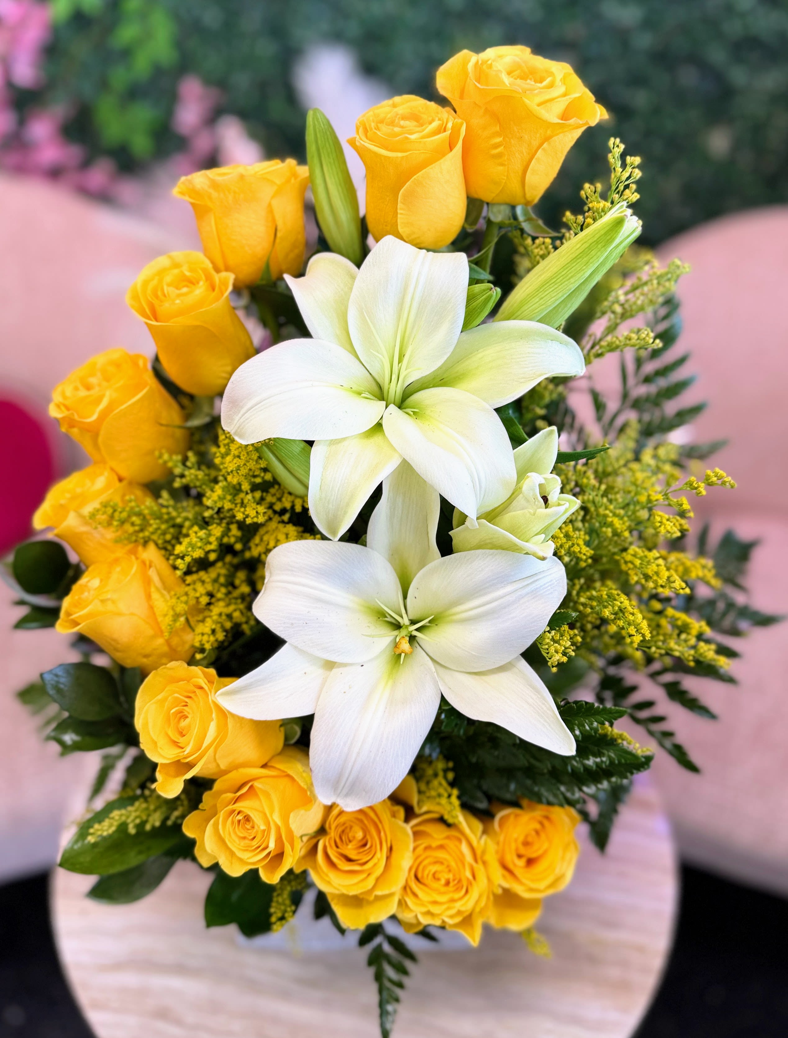 Encanto Amarillo - A radiant mix of elegance and cheer, this arrangement pairs the pure beauty of white lilies with the joyful glow of yellow roses. Together, they create a stunning balance of grace and sunshine—perfect for celebrations, heartfelt gestures, or brightening any day with warmth and sophistication.