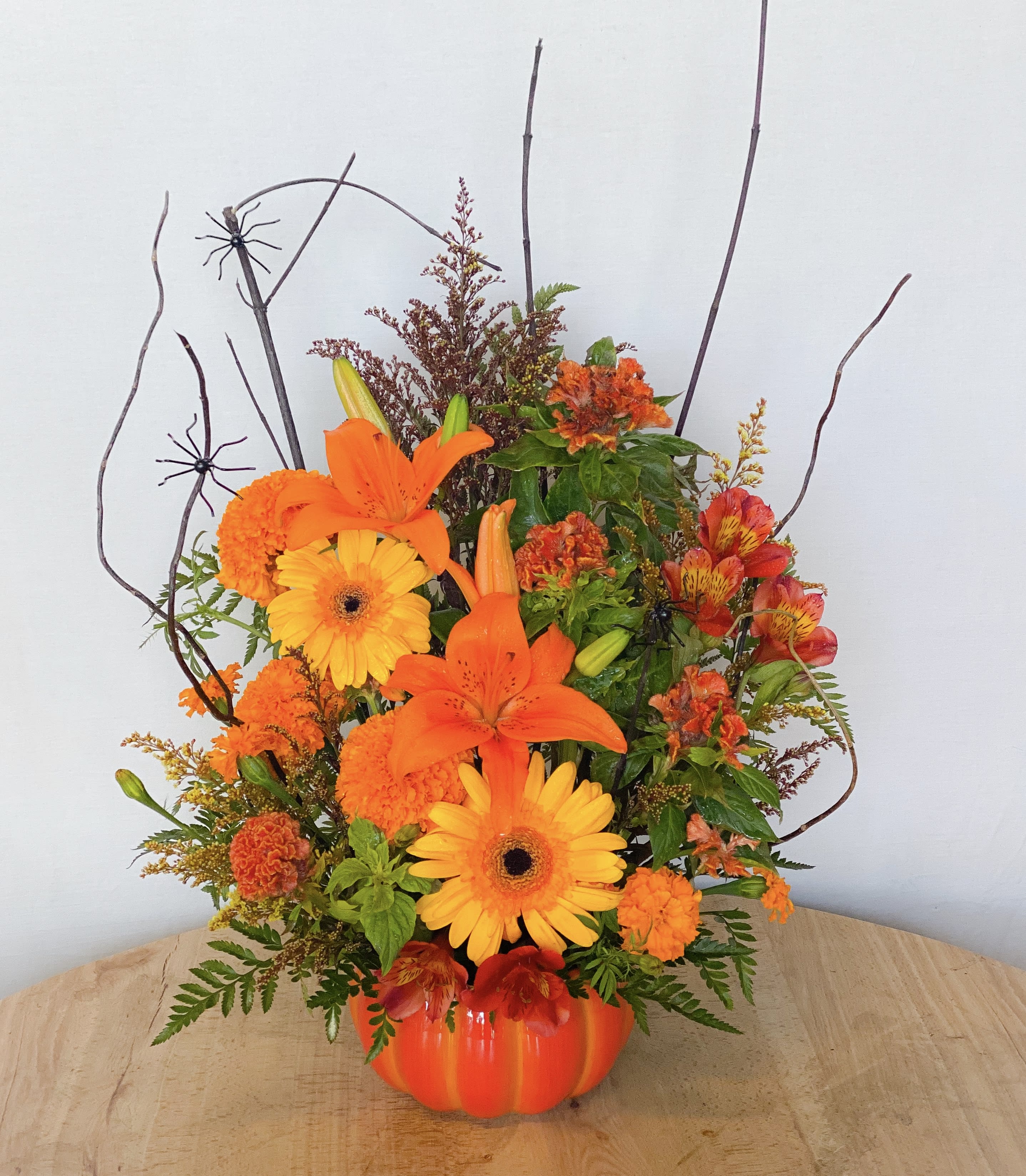 Creepy Crawly Pumpkin Creepy Crawly Pumpkin - It’s the pumpkin with seasoned autumn florals and all that crawls with it! Can be spiders, butterflies or creepy bugs and your family and guests will definitely talk about it! Perfect conversation piece for any party, a unique gift for fall, or a gesture gift just because. Approximately 16” H x 11” W