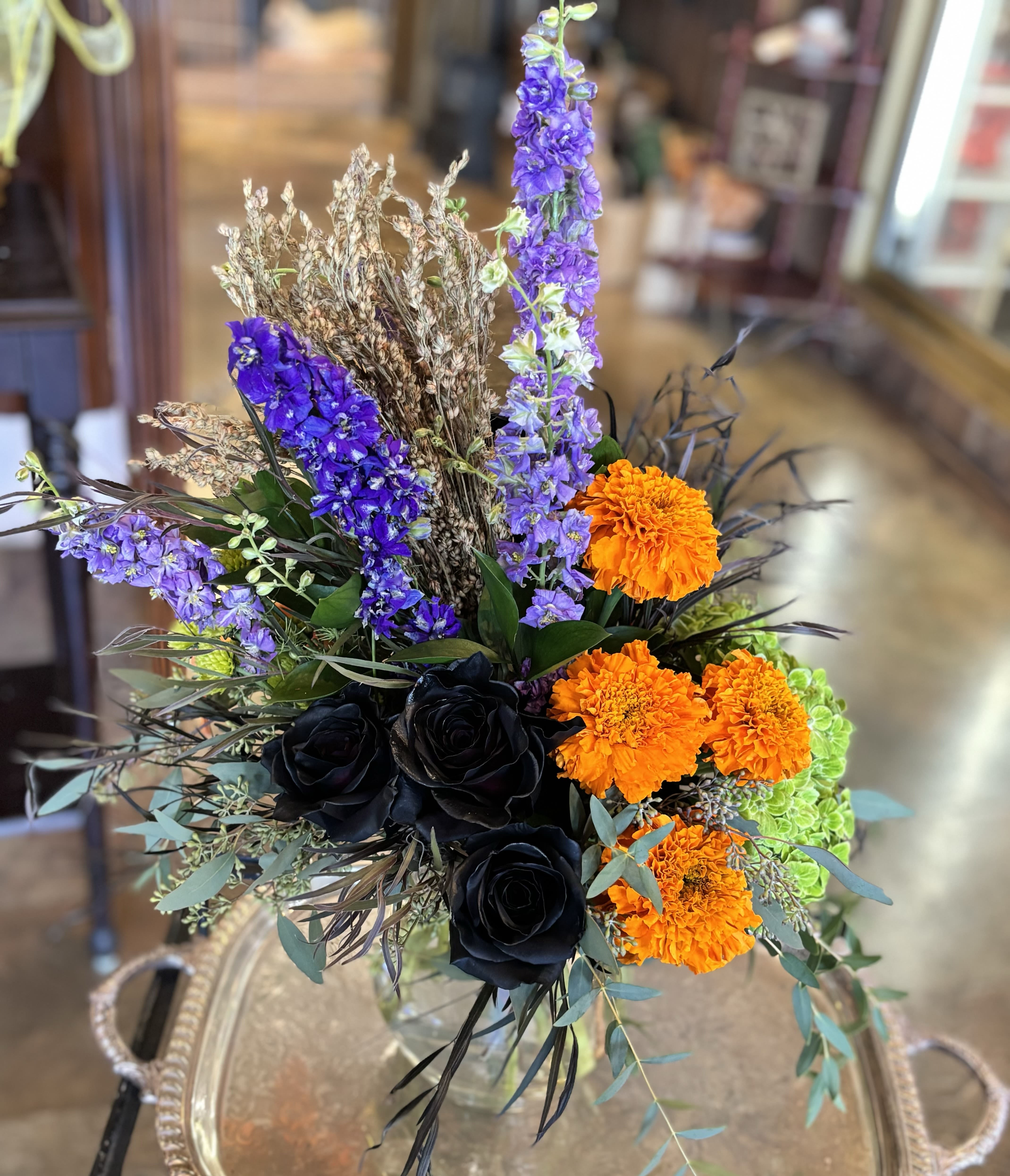 Eerie Sunrise - Spooky season is here! Need something for that fall-loving, Halloween obsessed friend? This is our pick! With it's black roses and October feeling, this arrangement will be perfect for any spooktastic occasion this season. 