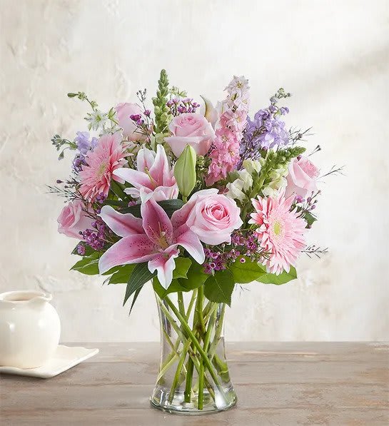 Always on My Mind - Stock photo is representative of the Standard Price. For any customizations please call the shop at 520-441-4968 When it comes to letting her know she’s always on your mind, think pink and lavender. We’ve hand-gathered a romantic mix of pink and purple blooms to create a gorgeous, garden-inspired bouquet.