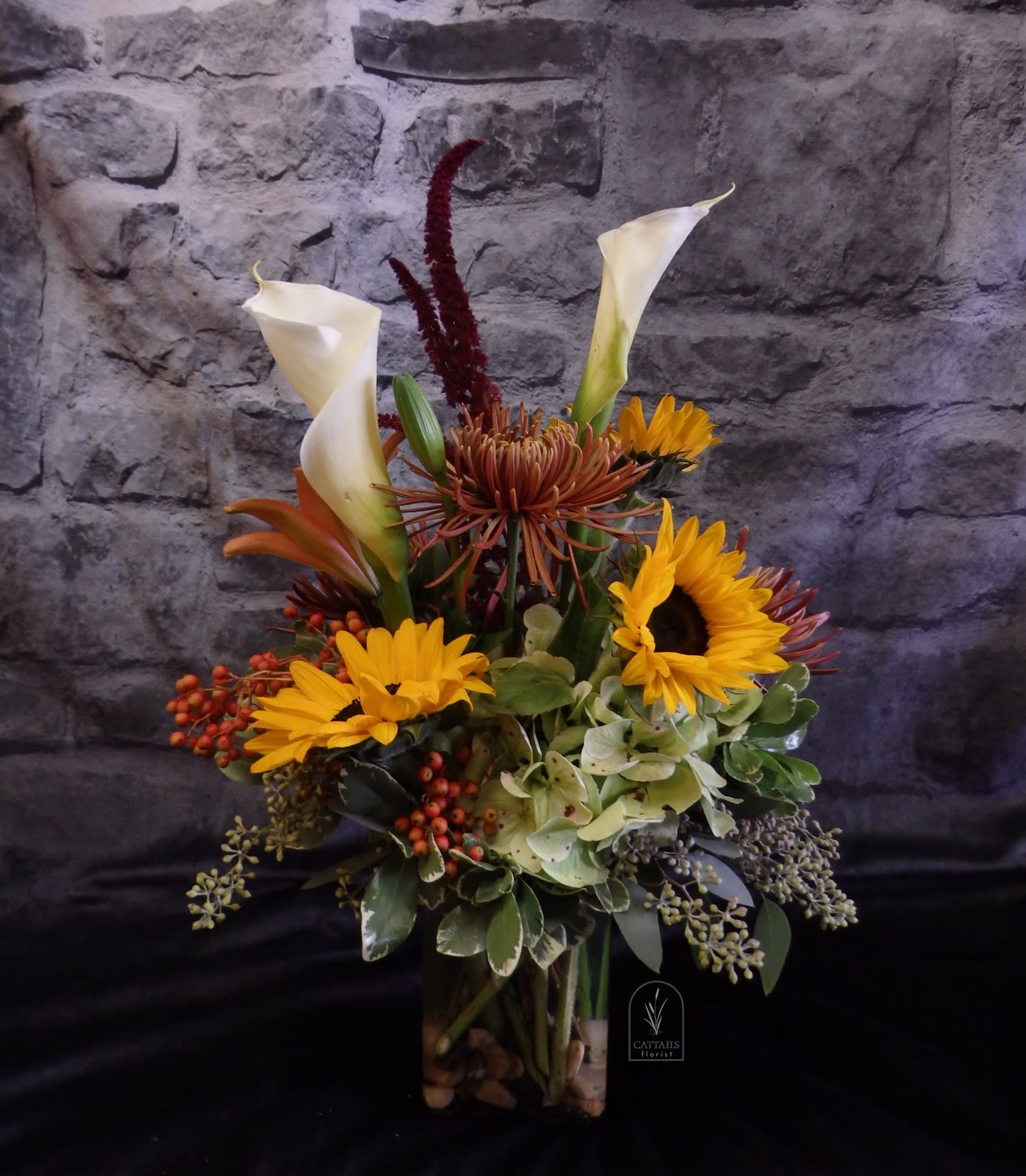 Safari Sun - &quot;Safari Sun&quot; is a striking fall arrangement featuring golden sunflowers, elegant callas, lilies, hydrangea, spider mums and unique safari-inspired blooms accented with rich textures and greenery. A warm and adventurous design, perfect for any occasion in Danville, CA.
