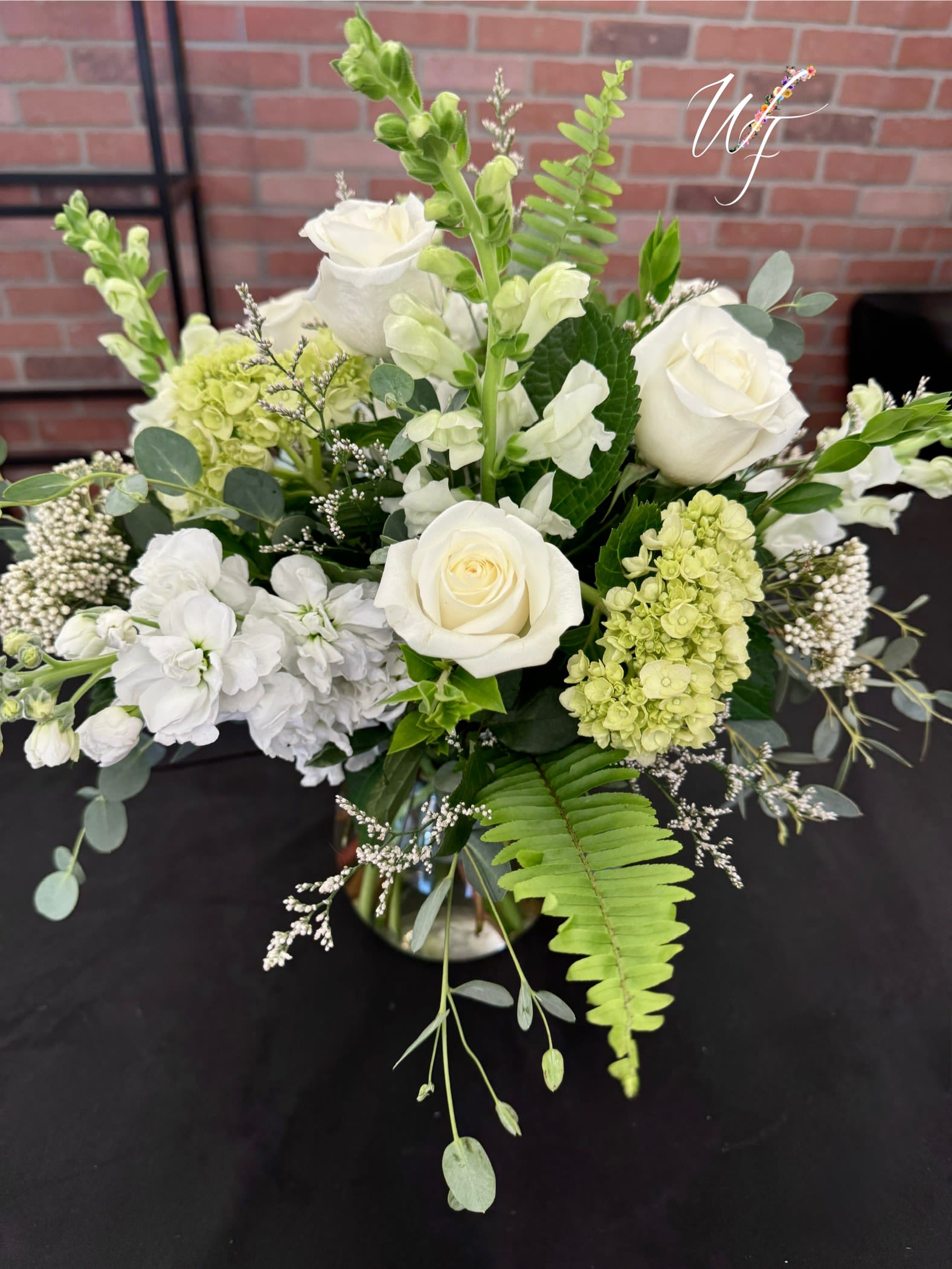 Wispy White’s - A variety of white blooms showcase between wispy lush greens.  **Please specify if you would like this designed short, medium or tall in the checkout instruction’s. 