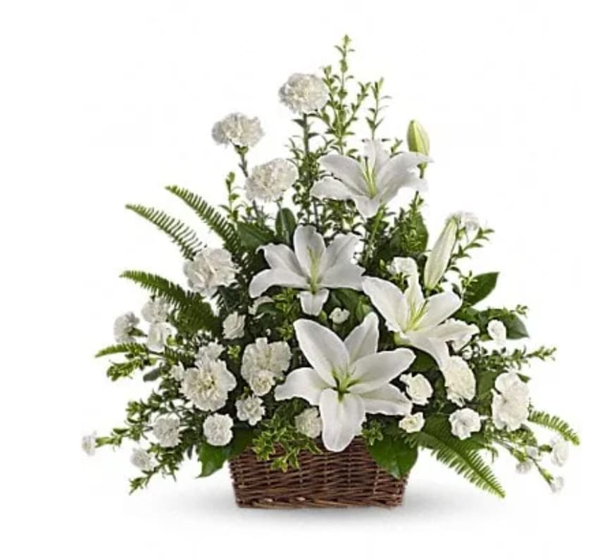 Peaceful White Lilies Basket - Peaceful White Lilies Basket - - Whether you send this beautiful arrangement to the family home or to the service, all will appreciate its elegance and grace. The contrast of brilliant white blossoms and dazzling greenery create a wonderfully calm and dignified setting. Gorgeous flowers such as white lilies, carnations and miniature carnations mix with vibrant greens in a large basket. Simply stunning.