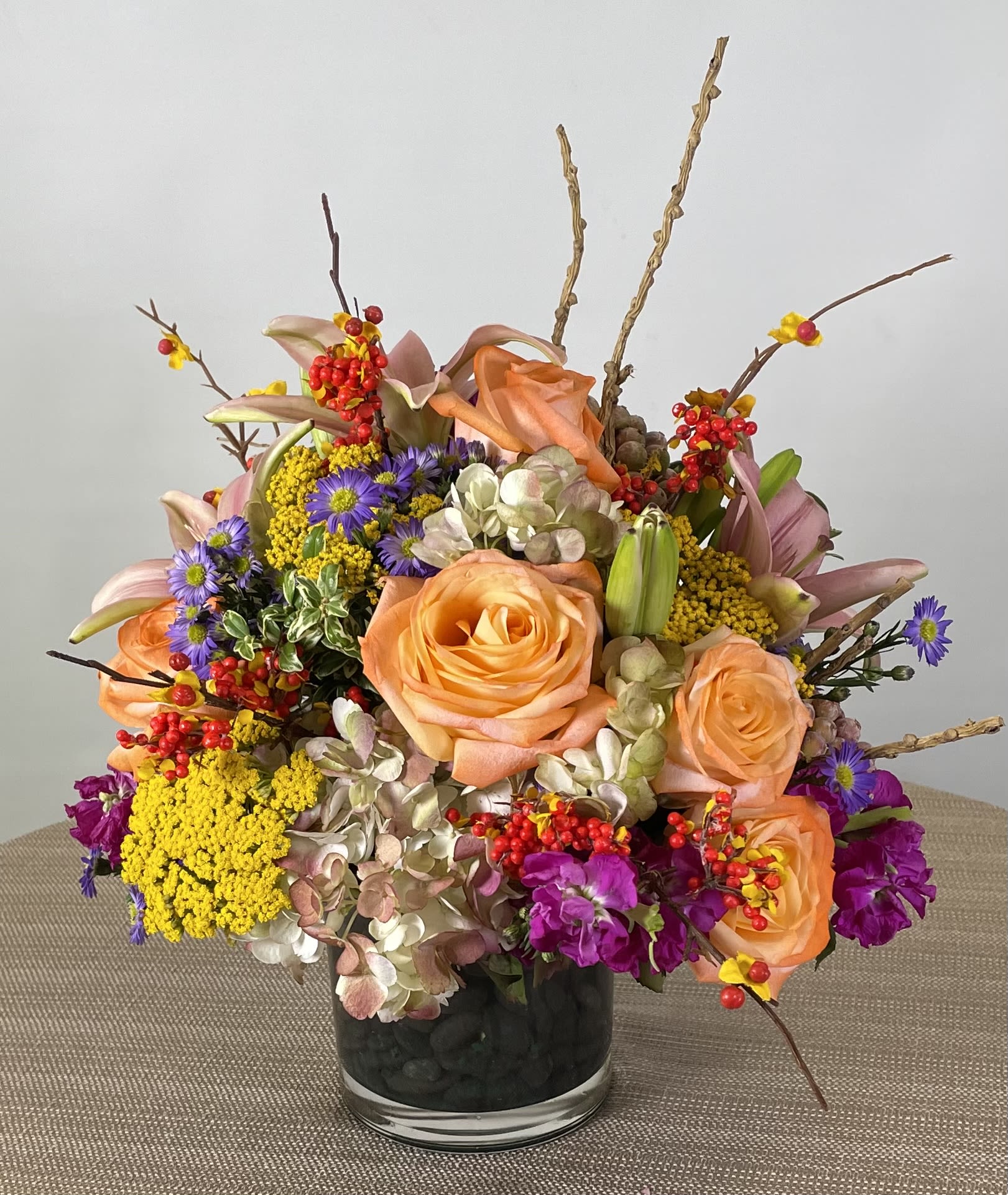 Last Rose of Summer - A seasonally appropriate selection of fully formed garden roses with accents of seasonal garden trimmings.
