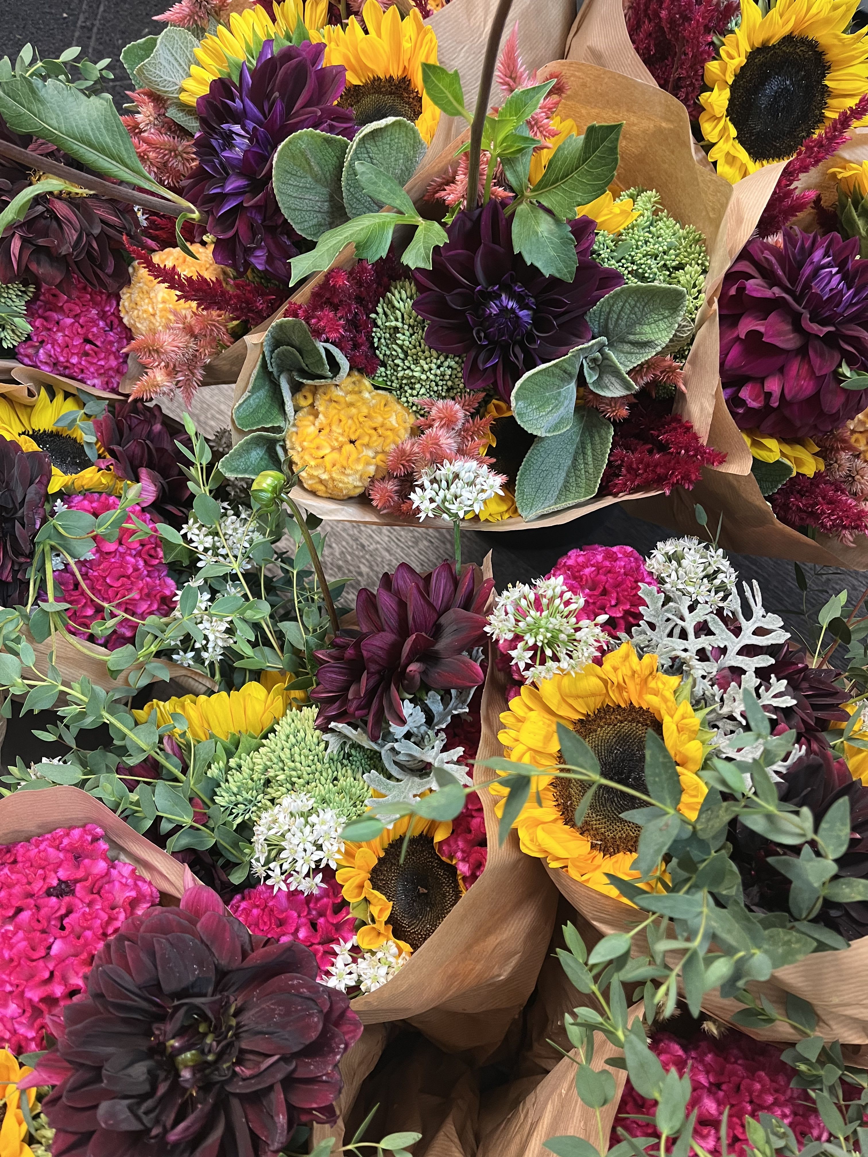 Wrapped bouquet autumn colors , designer's choice  Wrapped bouquet autumn colors , designer's choice  - A loose bouquet wrapped and ready to drop into your own vase. Our designers will choose fall colors and seasonal flowers and create a lush bouquet  AVAILABLE TUES - SAT