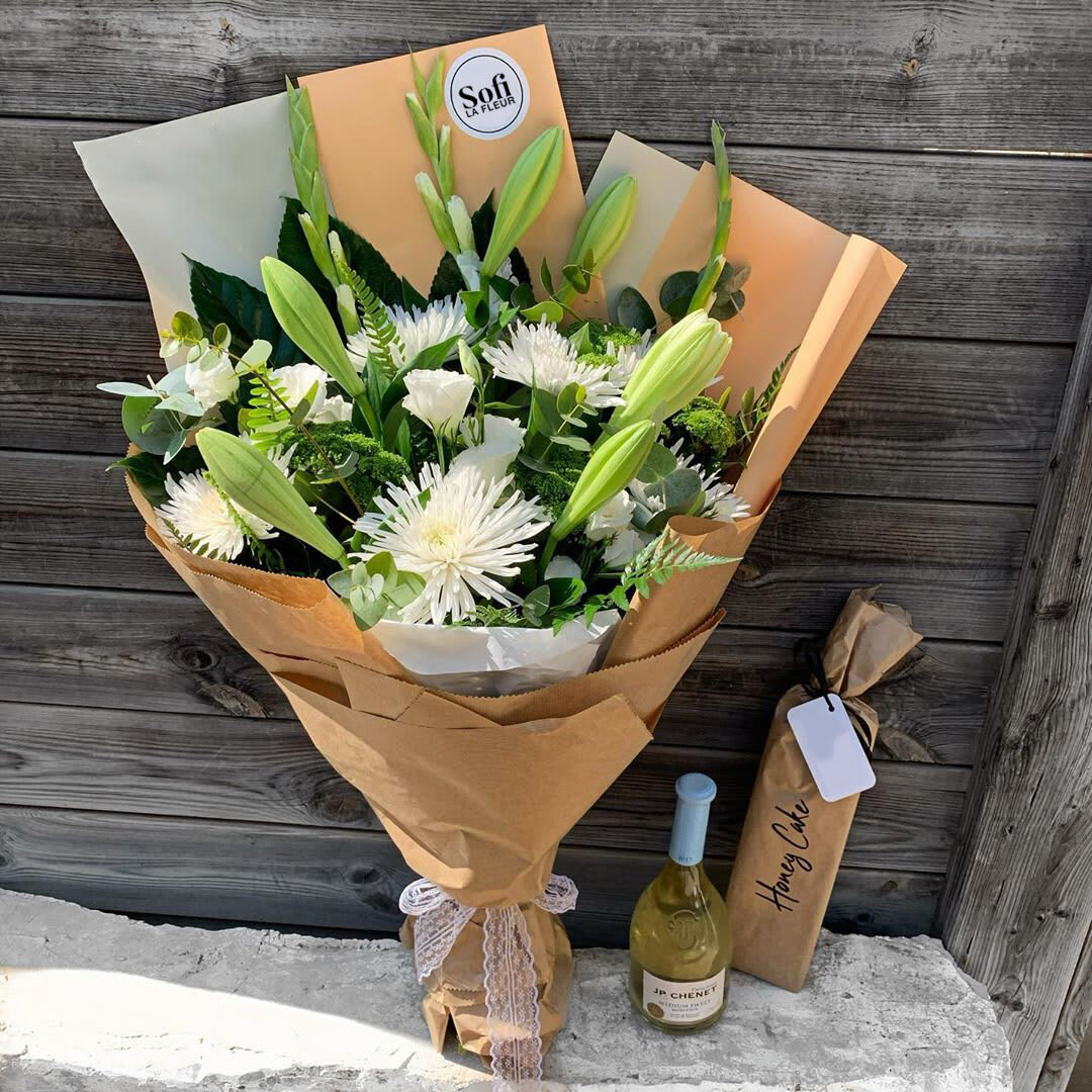 Snow Flakes - Explore our new flower collection,  melt their heart with our new white flower arrangement in a unique European wrapping. When flowers get a new division of style like never has been seen before.  *Wine not included* 