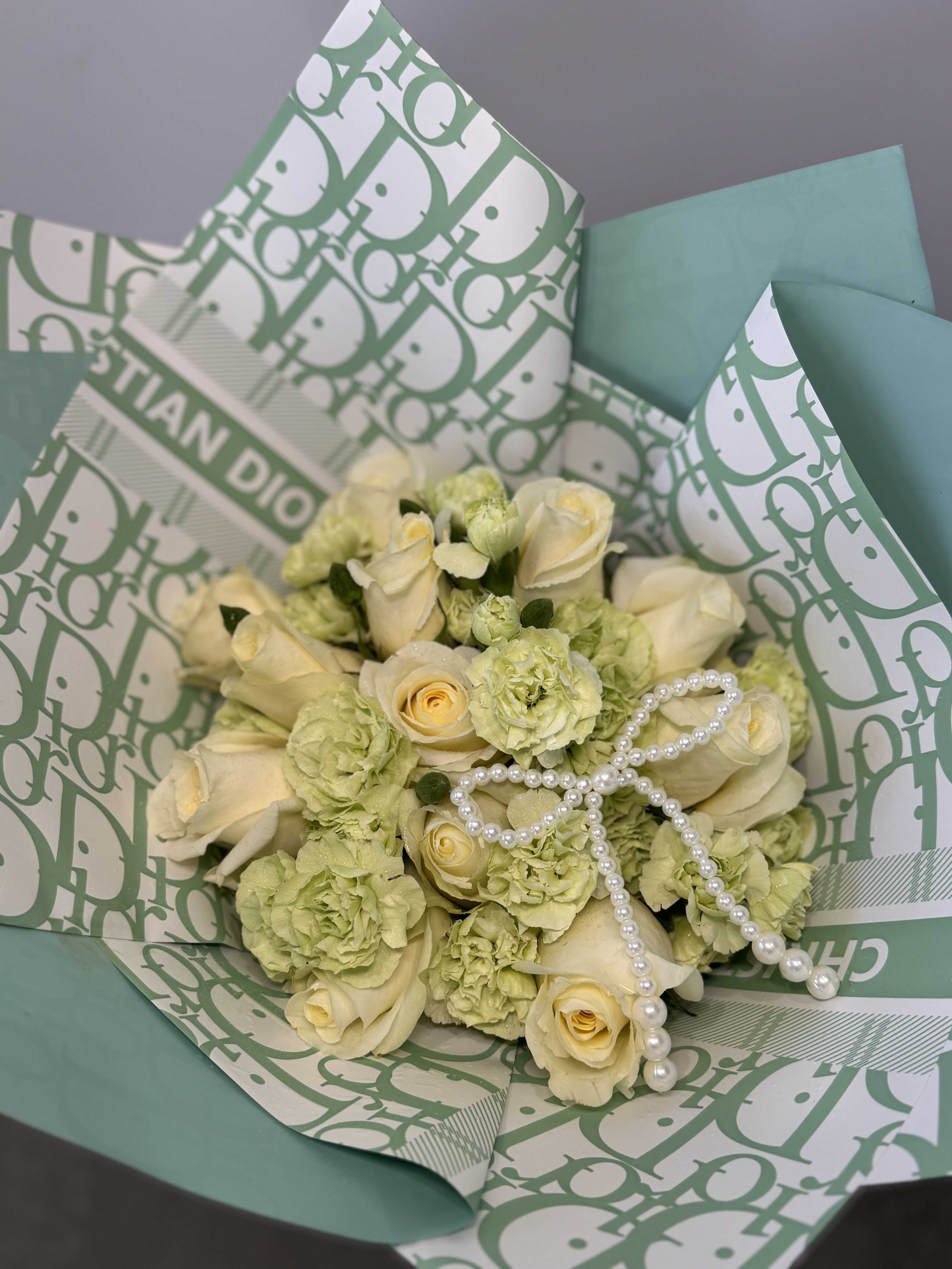 Green Dior  - Delicate bouquet buchon on a green paper combined with white roses.