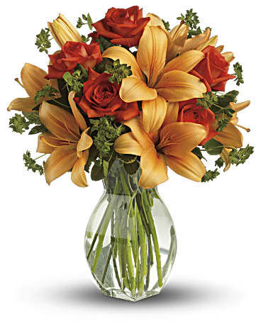 Fiery Lily And Rose Bouquet - As wondrous as a fiery sunset, this bold gift holds warm orange roses and fragrant Asiatic lilies. Approximately 15 inches wide and 18 inches tall for the Standard size.