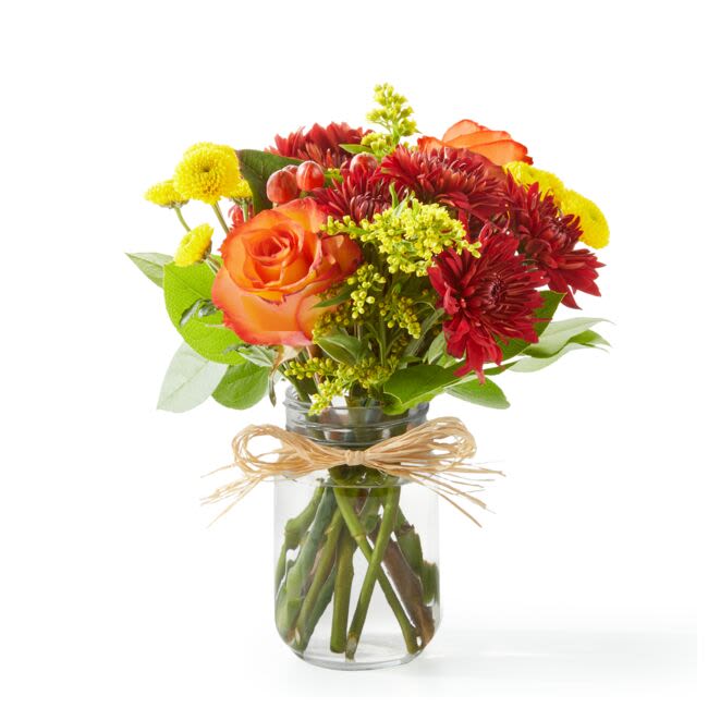 Apple Picking Bouquet (FTD) - Bring the fall festivities inside with this seasonal favorite! Orange roses, red mums, and other autumn blossoms come together beautifully in a mason jar. Approximately 12 inches wide and 15 inches tall for the Standard size.