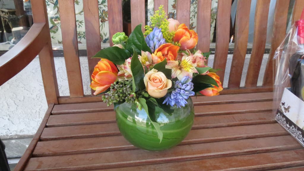 Bowl of Spring Bowl of Spring - Our favorite, it's just so pretty. This leaf wrapped bowl is filled with Tulips, Hyacinth and roses with a lovely array of greens and berries. A perfect centerpiece arrangement with a wonderful, soft fragrance. Choose a color pallet of your choice.