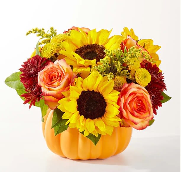 Golden Gourd Pumpkin - No need to go to the pumpkin patch this year with this gorgeous arrangement of seasonal stems, artfully arranged in a pumpkin vase to deliver some happiness. The Bouquet is approximately 10&quot;H x 11&quot;W.