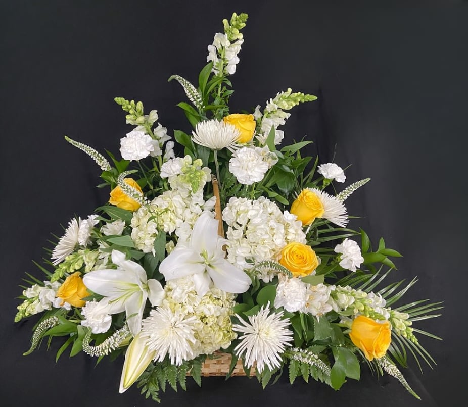 Glorious Heavens - Show them they will forever be in your heart with the Glorious Heavens Funeral Basket. A beautiful basket of white lilies, white hydrangeas, white snap dragons, white carnations, white fuji mums, and lovely yellow roses.