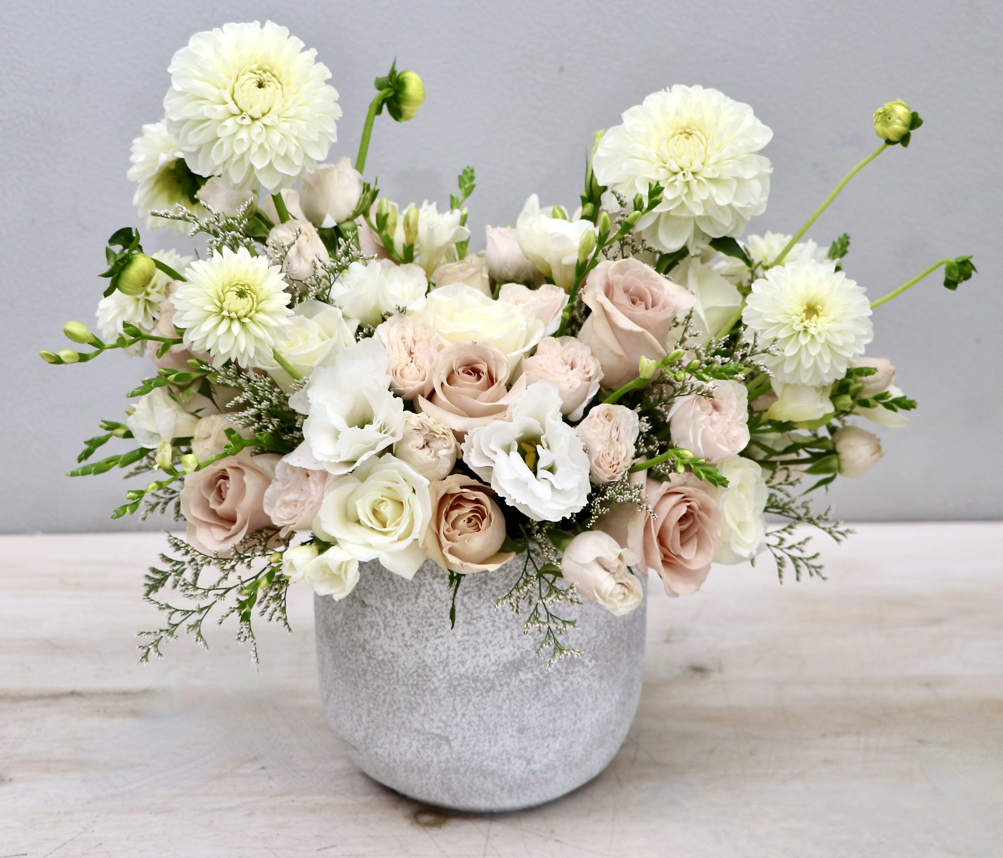 Blush Clouds - WeHo Blush Clouds - WeHo - White dahlias and blush roses are combined to make this elegant arrangment.