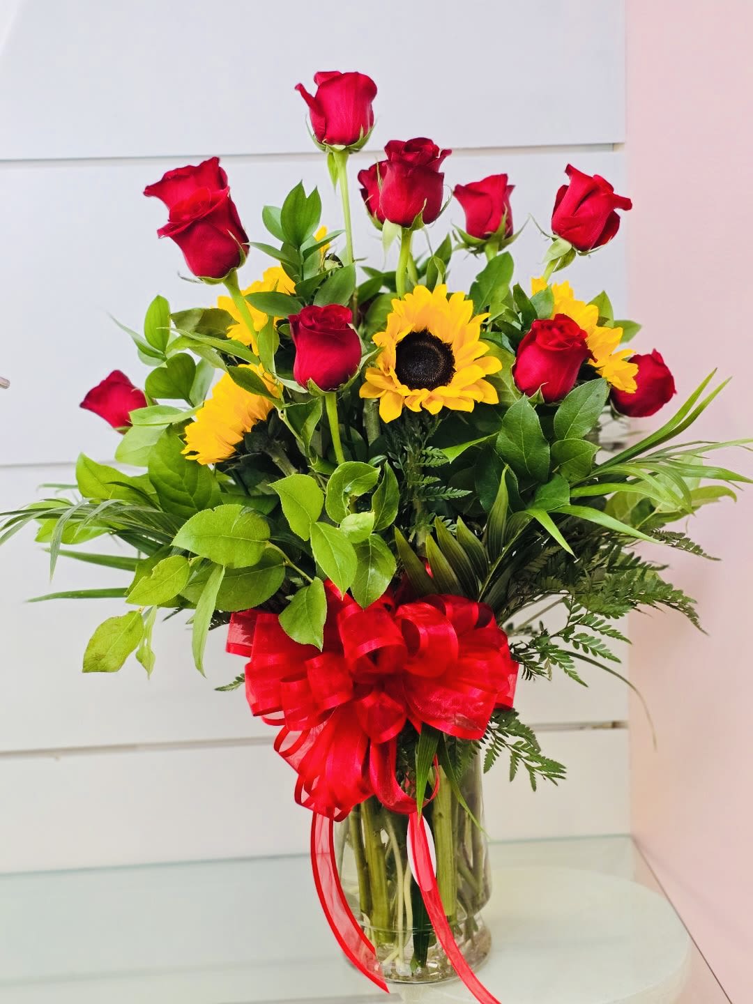 Sunflowers and Roses by Love &amp; Bloom  - This tall arrangement contains roses and sunflowers to perfectly showcase a huge love for your special person!