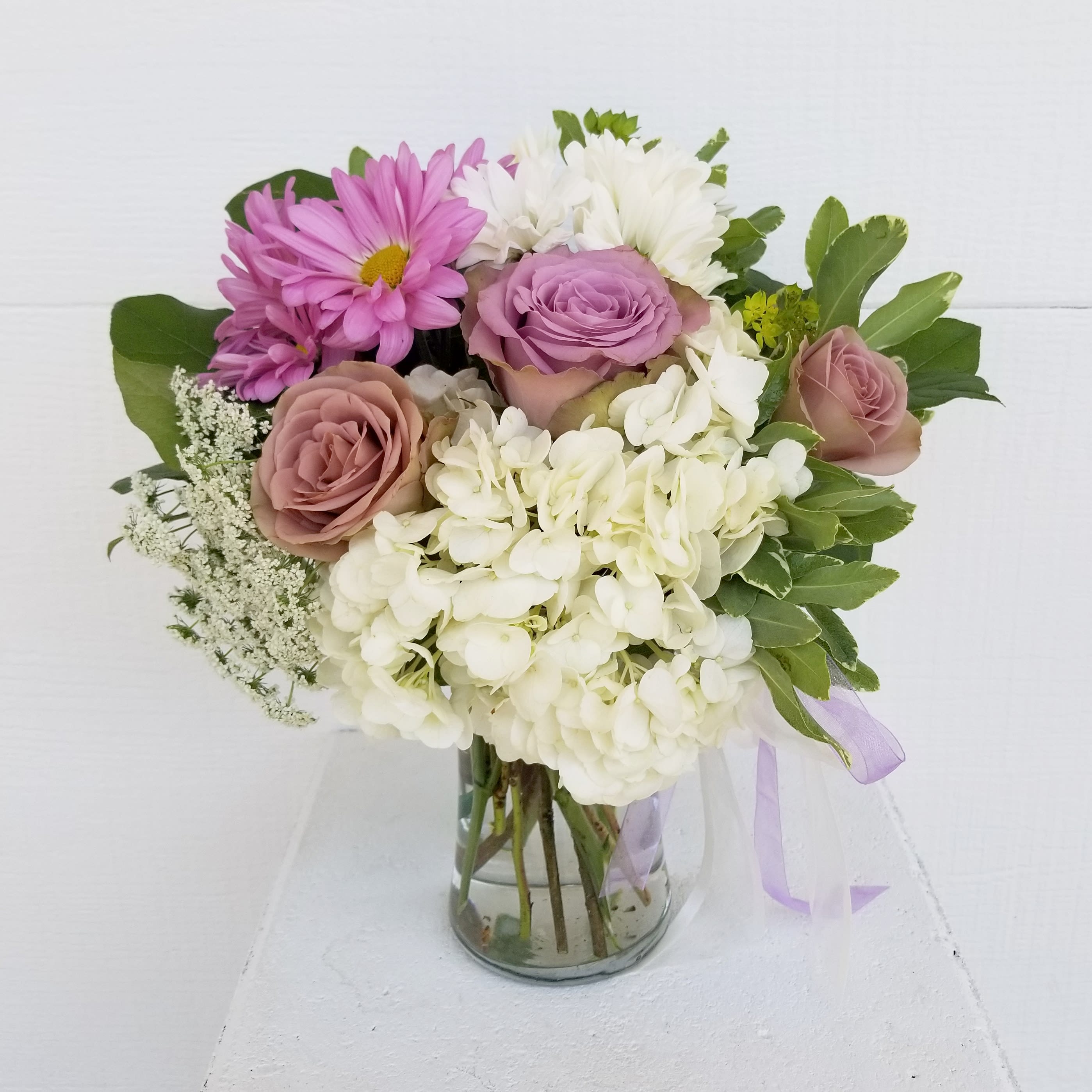 Lavender Love  - Small garden arrangement of lavender and white Daisy's with roses and hydrangea   Standard shown is 10&quot; tall  Deluxe shown is approximately 18&quot; tall  Premium goes in a bigger vase 