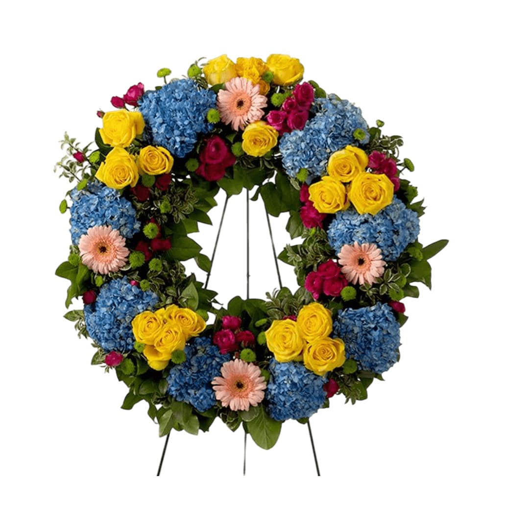 Vivid Spring Vivid Spring - This colorful and bright wreath spray is representative of a life lived to its fullest. Colors and Flowers may change based off of season and availability.