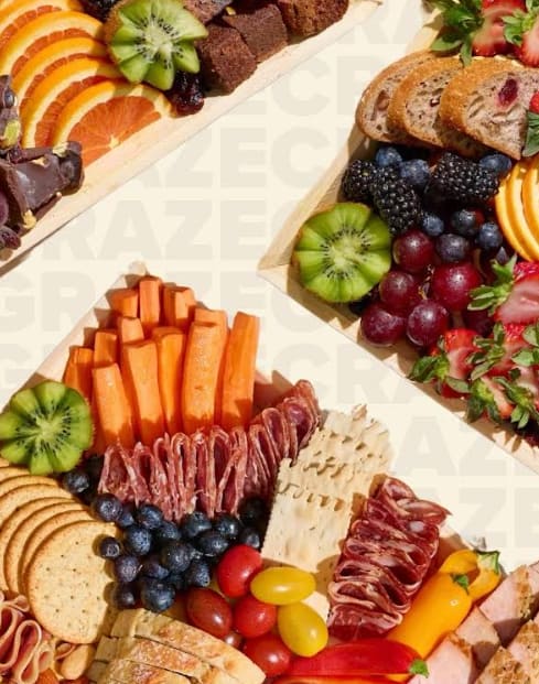 Charcuterie Box - Charcuterie Box Elevate their day with a beautifully curated charcuterie box. Perfect for two to four people, it features a selection of artisanal cheeses, cured meats, fresh and dried fruits, nuts, and crackers. It's the perfect complement to a beautiful bouquet or as a delightful gift on its own.