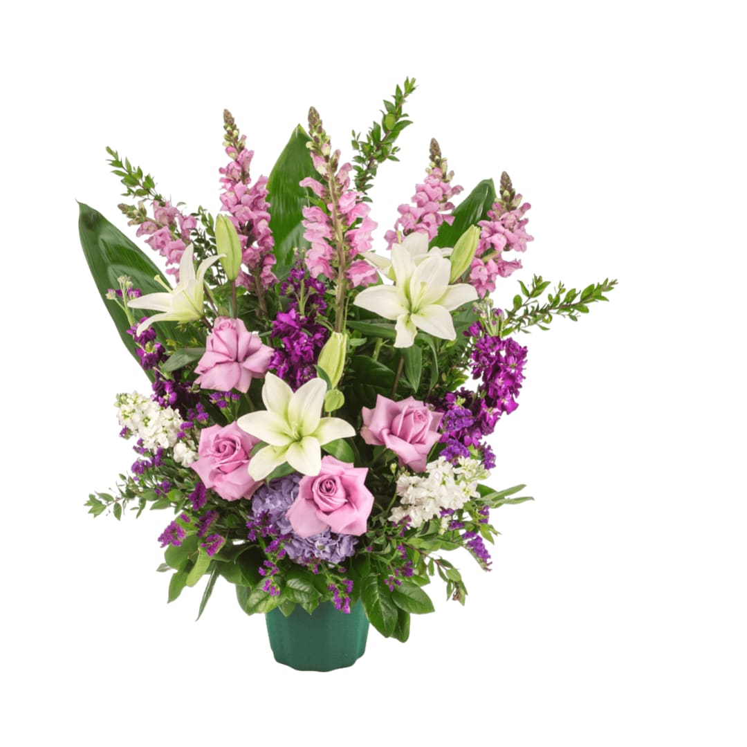 Purple Blessings  - A purple and white sympathy basket featuring snapdragons, roses, lilies, and stock. This fragrant arrangement works for every type of funeral ceremony.