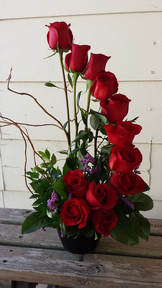 Stairway To Heaven - Red  Stairway To Heaven - Red - Red Roses Designed in a Tasteful Stair step. Curly Willow Accents Important Note: During the summer we guarantee our roses to last 24-48 hours