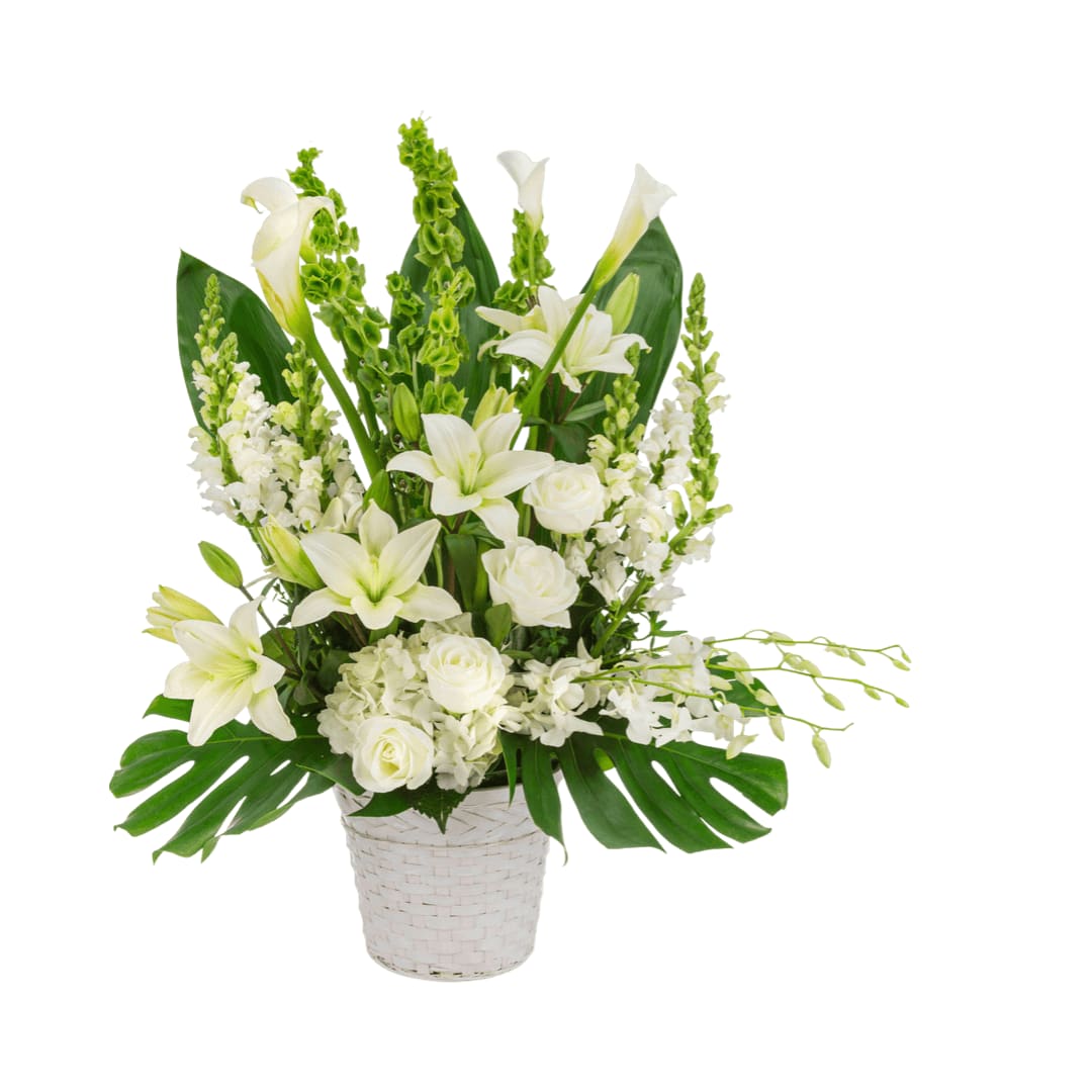 Hope Hope - An all-white funeral basket featuring lilies, roses, delphinium orchids, and more framed by a backdrop of large leaves. Suitable for any type of funeral ceremony