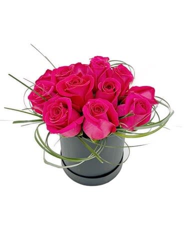Sexy Hot Pink box of Roses - A beautiful Black round box filled with 15 Hot pink Roses.