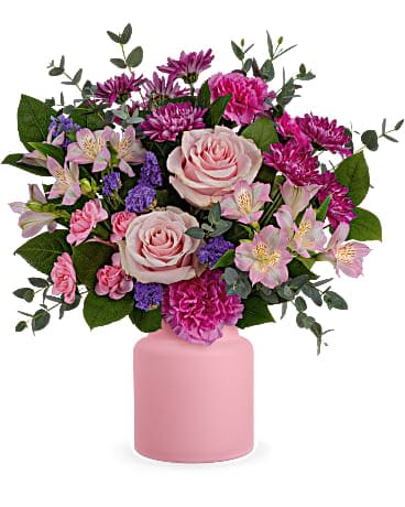 Teleflora's Sweet Savannah Bouquet - Make any day sweet as can be with soft, pastel-hued blooms, presented in a charming frosted glass jar. This bouquet features pink roses, pink alstroemeria, hot pink carnations, minature pink carnations, purple cushion spray chrysanthemums, purple sinuata statice, parvifolia eucalyptus and lemon leaf. Delivered in Teleflora's Savannah Jar.