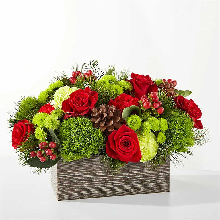 Happiest Holidays Wooden Box - Happiest Holidays Wooden Box is the perfect gift for a loved one or centerpiece for your holiday gathering. Bloom Details: Roses, Carnation, Mums, Hypericum Berries and more... WOODEN BOX approximately 12″H x 15″W  Place your Order Online Monday to Saturday before 1:00 p.m. (E.T.) for same-day delivery. “Orders received after hours will be delivered the next business day”. Check our coverage area. Occasionally, flowers and/or containers are substituted due to weather, seasonality, and market conditions, which may affect availability. If this is the case with the gift you’ve selected, we will ensure that the style, theme, and color scheme of your arrangement are preserved and will only substitute items of equal value or higher value.  CARE INSTRUCTIONS Keep the flower arrangement hydrated with natural water and change the water every two days. Do not spray any cleaning product on the flower arrangement. Do not place heavy objects directly on the flower arrangement. Keep flower arrangements out of direct sunlight and extreme heat.