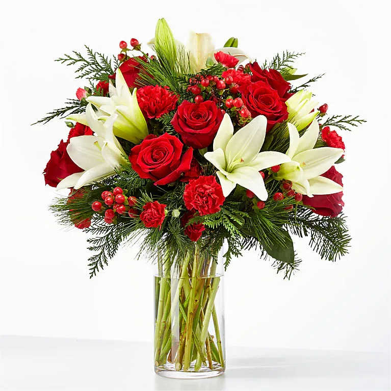 Jolly Bouquet Jolly Bouquet - Spread cheer to your loved ones near or far with the Jolly Bouquet, full of cozy red and white blooms perfectly capturing the holiday spirit. All Occasion Glass Vase Bloom Details Rose Lily Carnation and more... Place your Order Online Monday to Saturday before 1:00 p.m. (E.T.) for same-day delivery. “Orders received after hours will be delivered the next business day”. Check our coverage area. Occasionally, substitutions of flowers and/or containers happen due to weather, seasonality, and market conditions which may affect availability. If this is the case with the gift you’ve selected, we will ensure that the style, theme, and color scheme of your arrangement are preserved and will only substitute items of equal value or higher value. CARE INSTRUCTIONS Keep the flower arrangement hydrated with natural water and change the water every two days. Do not spray any cleaning product on the flower arrangement. Do not place heavy objects directly on the flower arrangement. Keep flower arrangements out of direct sunlight and extreme heat.