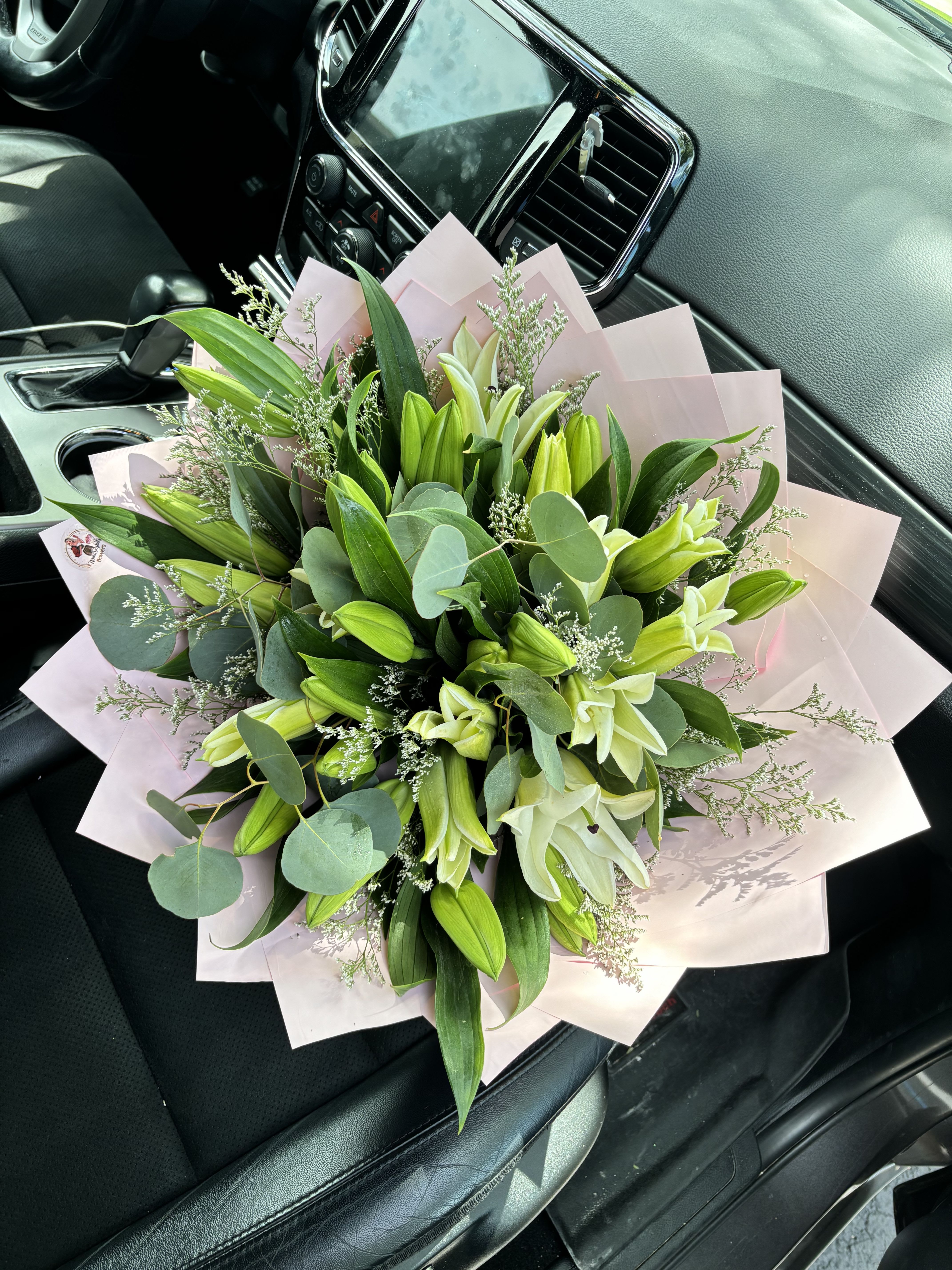 Elegant White Lily Bouquet - A timeless expression of grace and sophistication, our White Lily Bouquet is designed to captivate with its fresh, natural beauty. Featuring lush white lilies surrounded by vibrant greenery and delicate filler flowers, this arrangement embodies purity, elegance, and charm. Wrapped in soft blush pink paper for a refined finish, it’s the perfect gift for birthdays, anniversaries, celebrations, or simply to brighten someone’s day.   Ideal for any occasion  Fresh, long-lasting blooms  Handcrafted with care