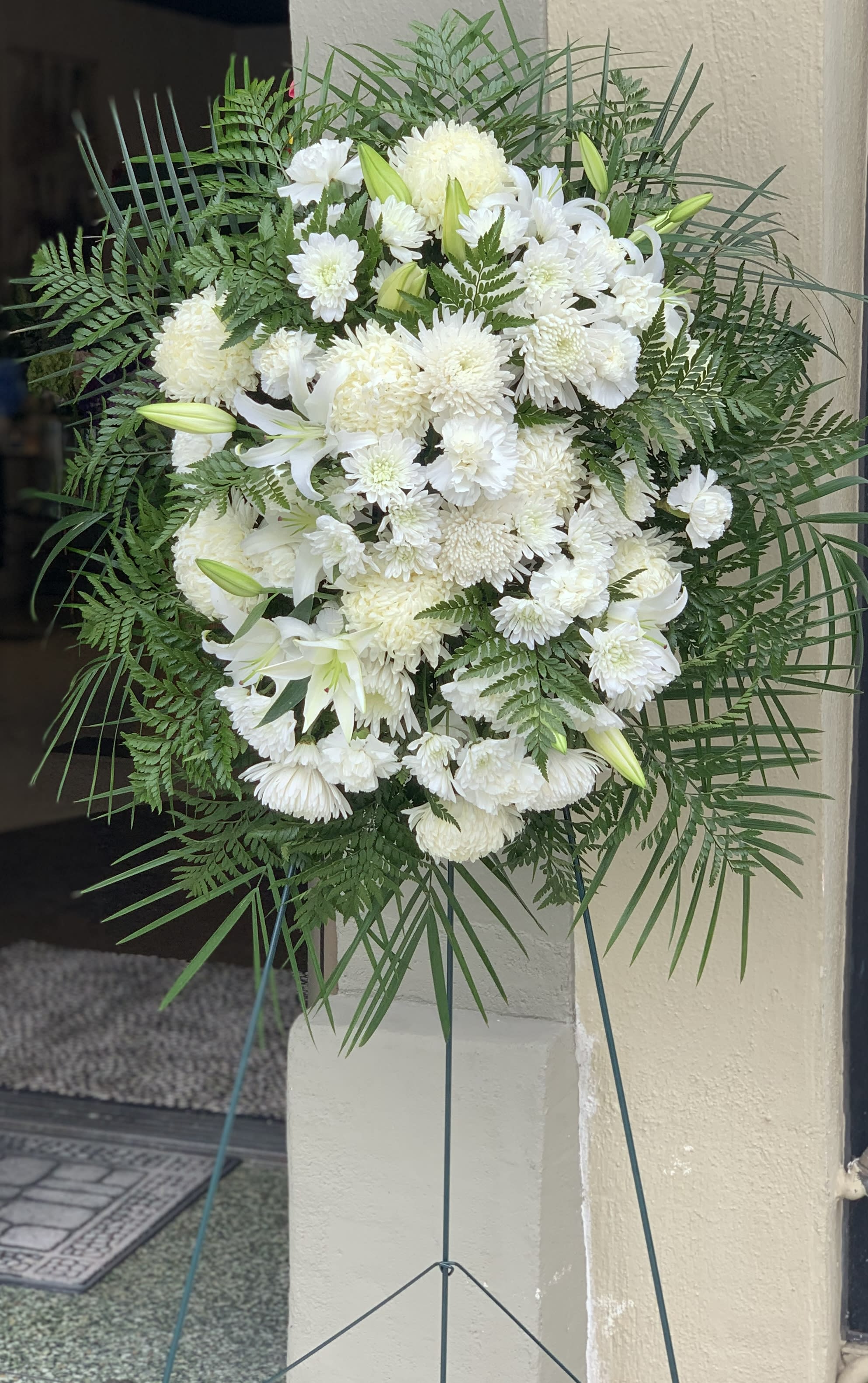 White Funeral Spray White Funeral Spray - An elegant floor spray composed of whites and greens.