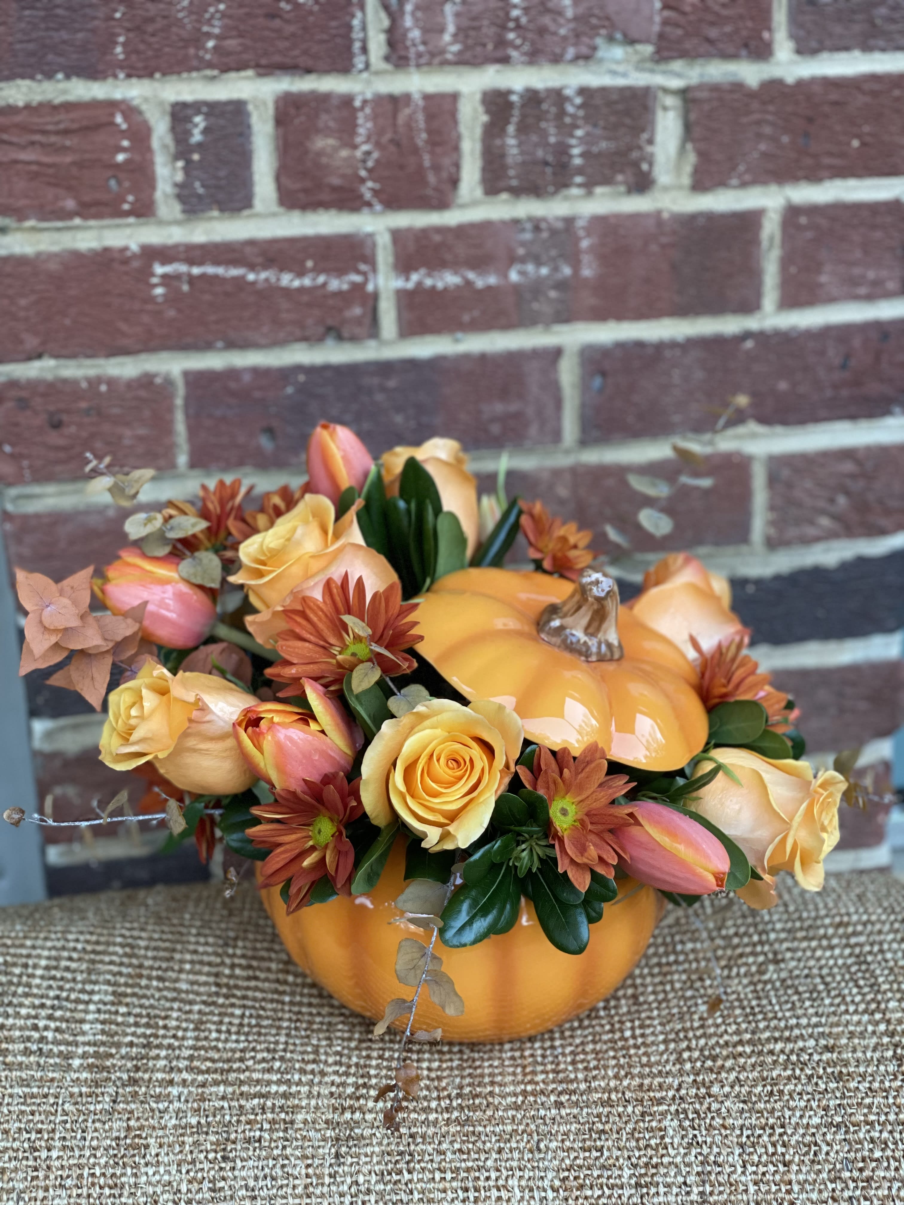 Pumpkin Illusion - A beautiful arrangement beautifully complimented by a pumpkin vase to set the autumn mood. 