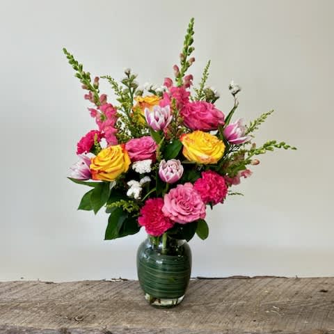Just Because Just Because - A tall rose vase with Roses, Snapdragons, Tulips, Carnations, Solidago, Statice and Lemon leaf. Colors are subject to change slightly.