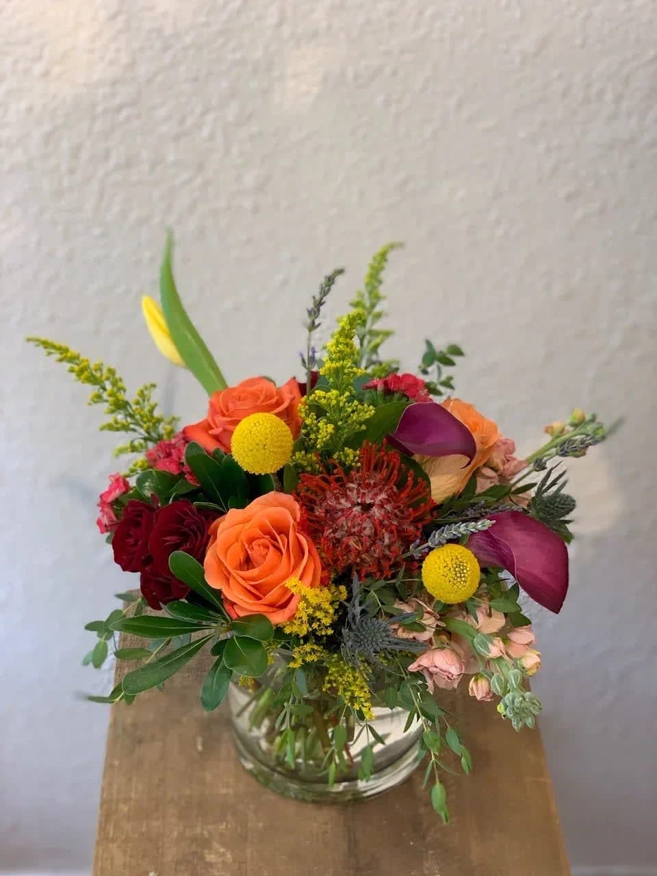 Colorado Sunset - Roses, Protea, Calla Lilies, Stock, Billy Balls, and thistle all designed to represent our wonderful state's beautiful sunsets.  