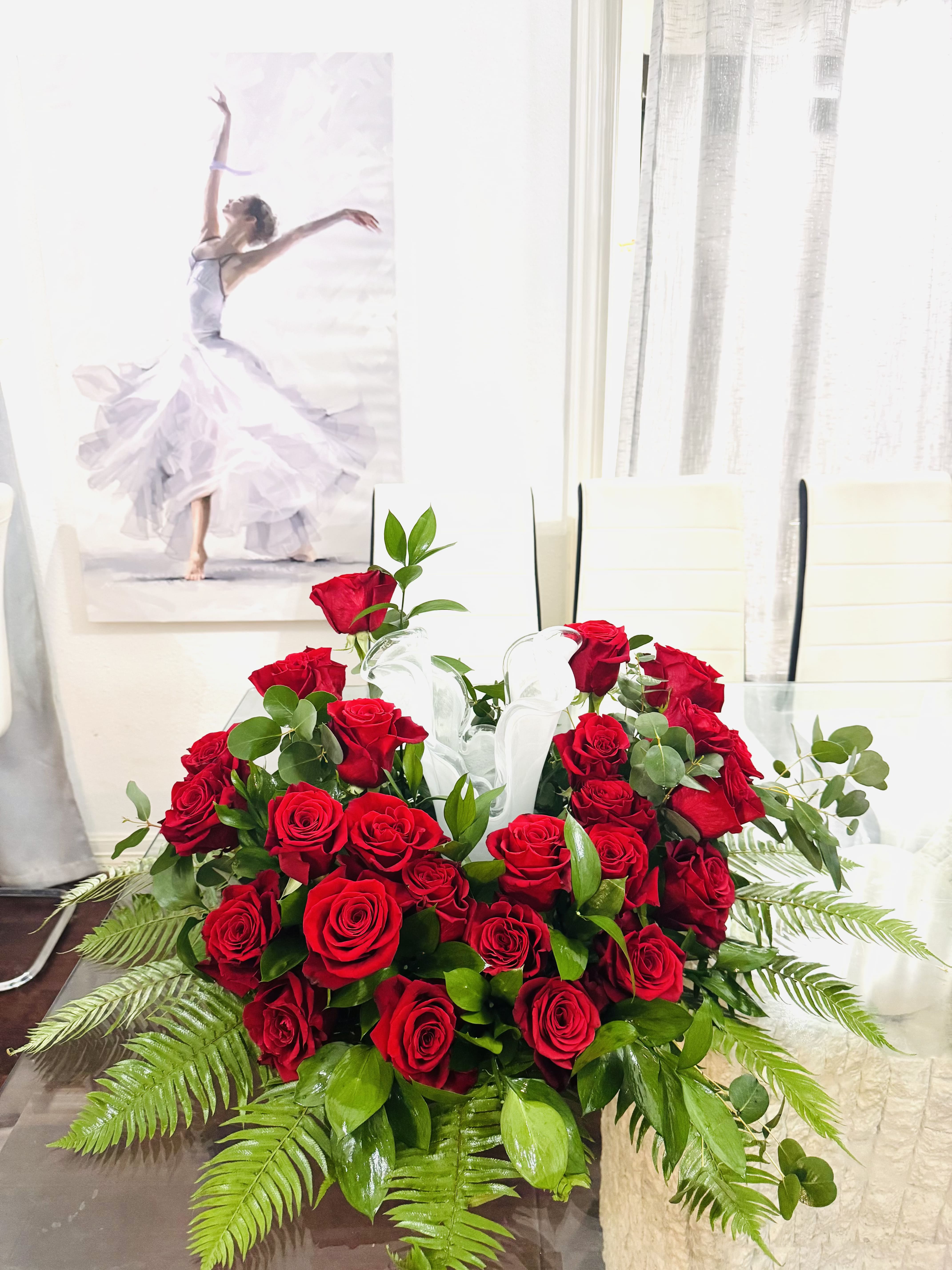 Forever In Our Hearts Forever In Our Hearts - A dignified tribute, this arrangement is adorned with a lush bed of classic red roses, symbolizing eternal love and profound remembrance. Nestled among fresh greenery and accented with tender buds, the roses gently embrace a central, creating a serene and reverent display. Designed to honor a cherished soul with beauty, passion, and respect, this arrangement speaks a silent promise: you are forever loved, never forgotten. NOTE: the vase is not included in the arrangement.