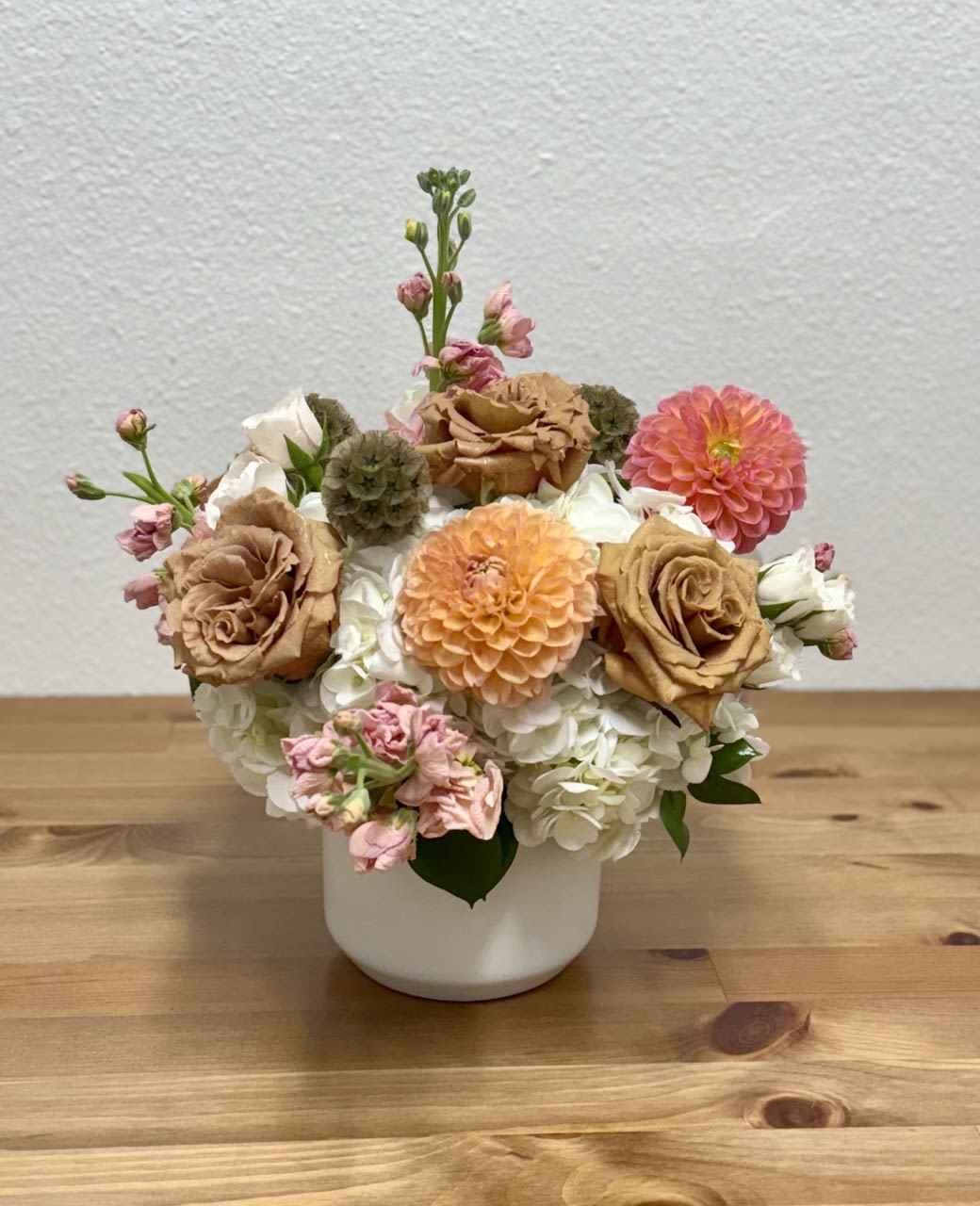 Toffee - Elevate your space with a stunning mix of Toffee garden roses with other flowers artfully arranged in a Kendall vase. Immerse yourself in luxury as vibrant colors and delicate fragrances enchant your senses. It's a refined experience that captivates with every glance, adding a touch of sophistication to any setting.