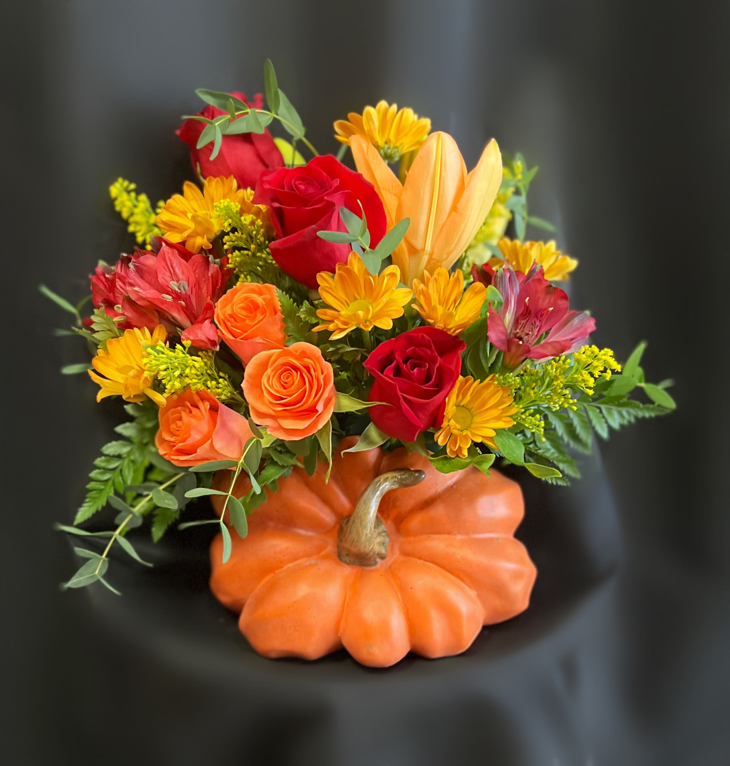 SPICY PUMPKIN LATTE BQT - ROSES, LILIES, DAISIES, ALSTROS, SPRAY ROSES, GREENS AND SOLIDAGO IN A PUMPKIN VASE