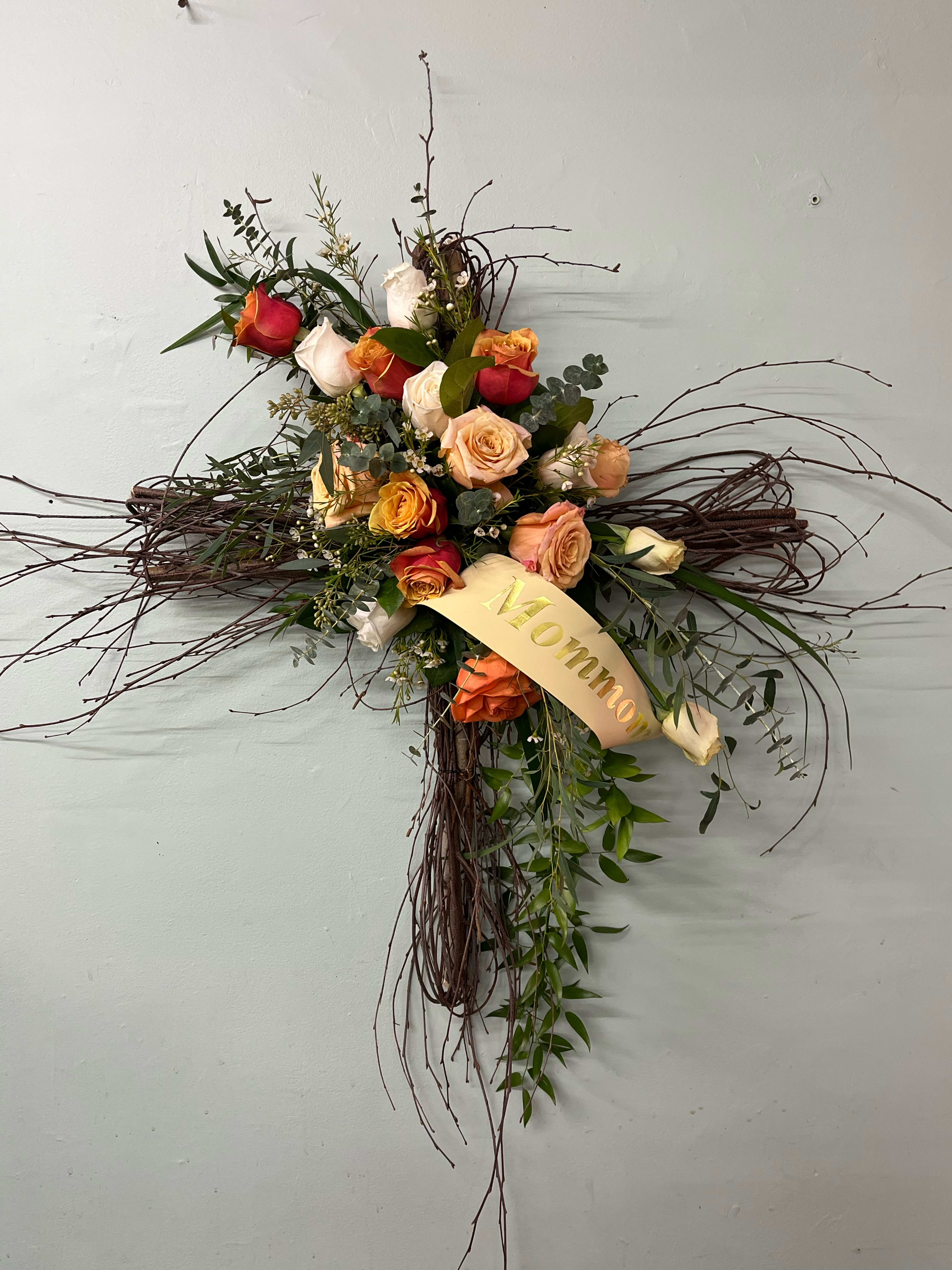 Peach Twig Cross - Made out of twigs and added fresh flowers! Please call the shop for color availability. 