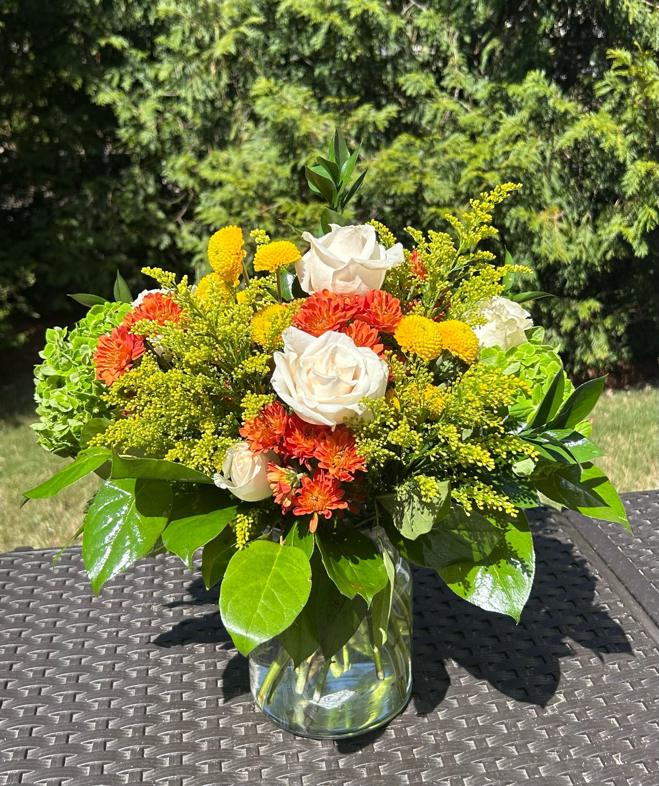  Gianna  - Light, elegant, and full of seasonal color, the Fall Foliage Bouquet is the perfect way to say “thank you,” “I love you,” or simply brighten someone’s day. Bloom Details: Ross, Hydrangea, Solidago Clear Glass All Occasion  Place your Order Online Monday to Saturday before 1:00 p.m. (E.T.) for same-day delivery. “Orders received after hours will be delivered the next business day”. Check our coverage area.  Occasionally, flowers and/or container substitutions happen due to weather, seasonality, and market conditions, which may affect availability. If this is the case with the gift you’ve selected, we will ensure that your arrangement's style, theme, and color scheme are preserved and will only substitute items of equal value or higher value.  CARE INSTRUCTIONS Keep the flower arrangement hydrated with natural water and change the water every two days. Do not spray any cleaning product on the flower arrangement. Do not place heavy objects directly on the flower arrangement. Keep flower arrangements out of direct sunlight and extreme heat.