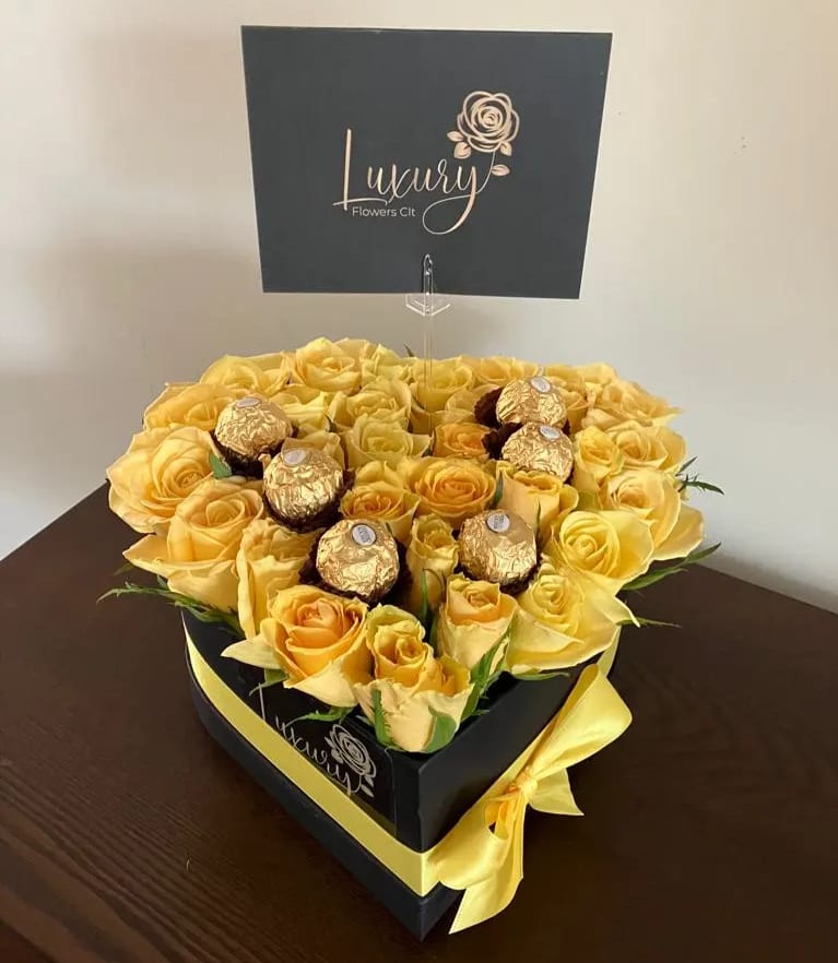 Candy Heart Box - Candy Heart Box is an exclusive design of fresh roses and chocolates in beautiful boxes. If you want to surprise your loved one with a special gift, look no further because you are in the right place.  The Heart Box will be delivered approximately as pictured.  All Occasion  Place your Order Online Monday to Saturday before 1:00 p.m. (E.T.) for same-day delivery.  “Orders received after hours will be delivered the next business day”. Check our coverage area. Occasionally, substitutions of flowers and/or containers happen due to weather, seasonality, and market conditions, which may affect availability. If this is the case with the gift you’ve selected, we will ensure that your arrangement's style, theme, and color scheme are preserved and will only substitute items of equal value or higher value.  CARE INSTRUCTIONS Gently mist the arrangement with natural water every other day. Do not spray any cleaning product on the flower arrangement. Do not place heavy objects directly on the flower arrangement. Keep them out of direct sunlight and extreme heat. 