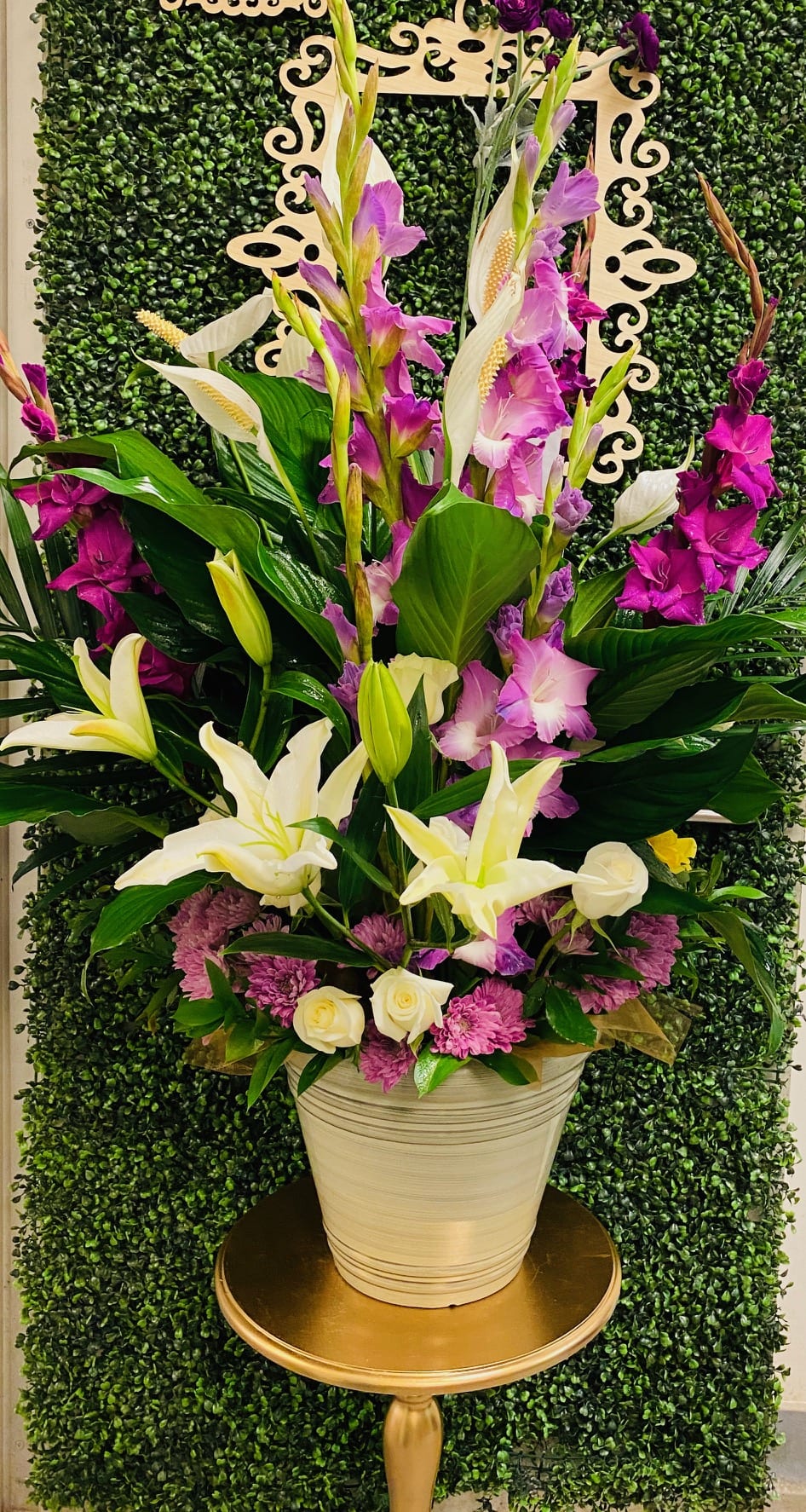 Peace Lily Elevation Plantscape - Peace Lily Elevation Plantscape makes a stunning presentation and gift for the home, office or memorial services. Long-lasting, colorful and fragrance light. 