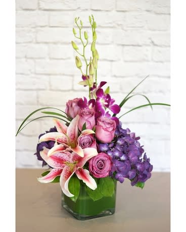Purple Paradise - Purple Paradise is a gorgeous touch of this and that. If she loves variety and enjoys purple and pink blooms, this is a great choice for her!   Lilies arrive in varying stages of opening.
