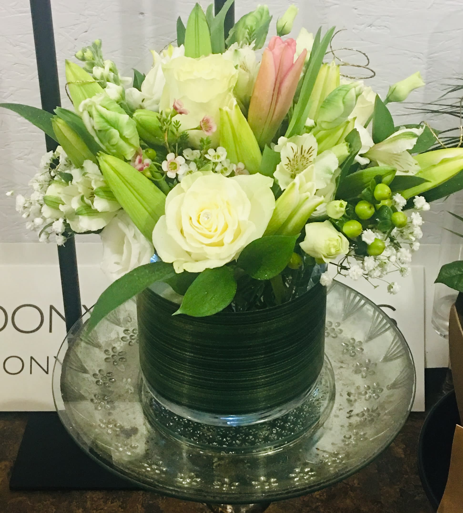 Rose Lily Garden by Donya's Florals, Saint Augustine - This All Seasons design is filled with white, soft pink and green blooms, a cheery floral asiatic lily centerpiece for the person needing it most.