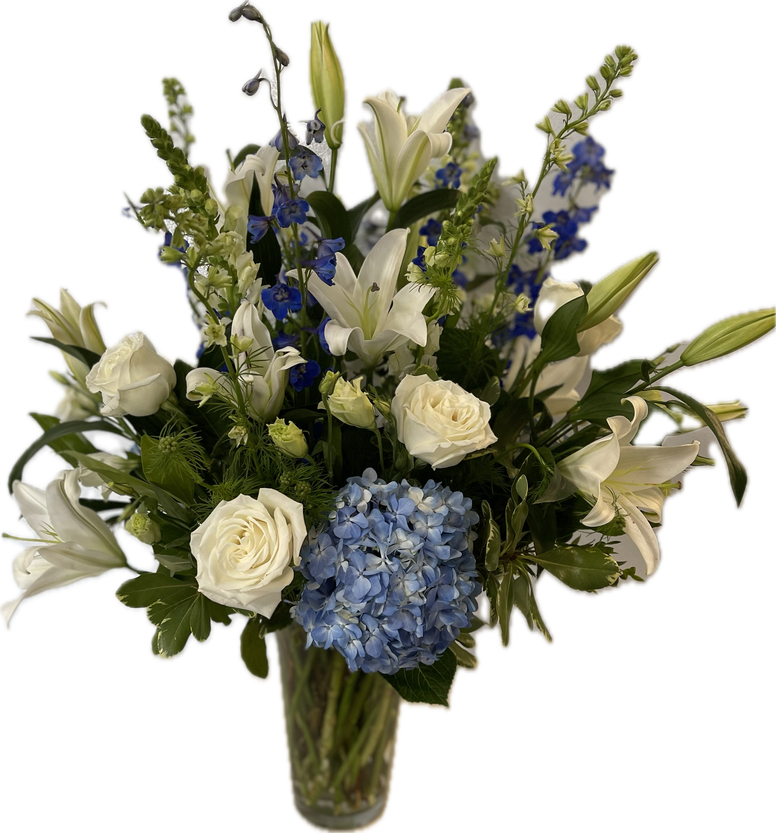 Breezy by the Sea Breezy by the Sea - This arrangement contains delphinium, asiatic lilies, hydrangea playa blanca roses and other seasonal blooms. It is a great gift for a birthday, get well, for wishing someone a fresh start.