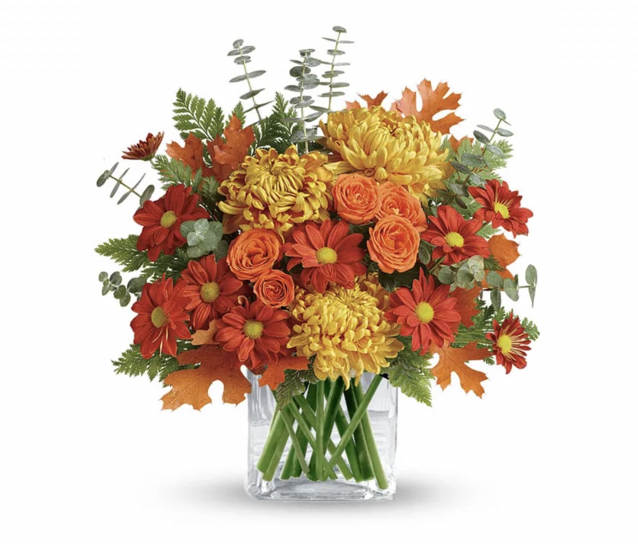 Fall Fragrance - Fragrant roses, eucalyptus, and mums will fill your home with the fresh floral scents of fall! Treat yourself or a loved one to a festive fall bouquet filled with their favorite orange, bronze, and red blooms. This chic bouquet is sure to put a smile on their face whether it's their birthday, anniversary, or you're sending them a gift just because!  PLEASE NOTE: Florist reserves the right to make modifications to the design based on seasonality and accessibility of blooms and vases. Any modifications made will honor the palette, intent, and feeling of the pictured design. Contact floral designer directly with any specifications or concerns.