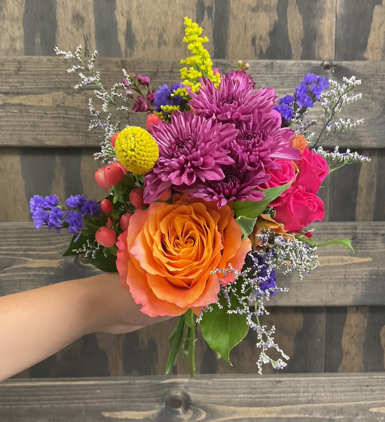 Miami - A bright and colorful nosegay bouquet is perfect for holding during pictures!  Pick up dates for homecoming are Saturday, September 27th and Saturday, October 4th. Please call if you need to order this for a different event.